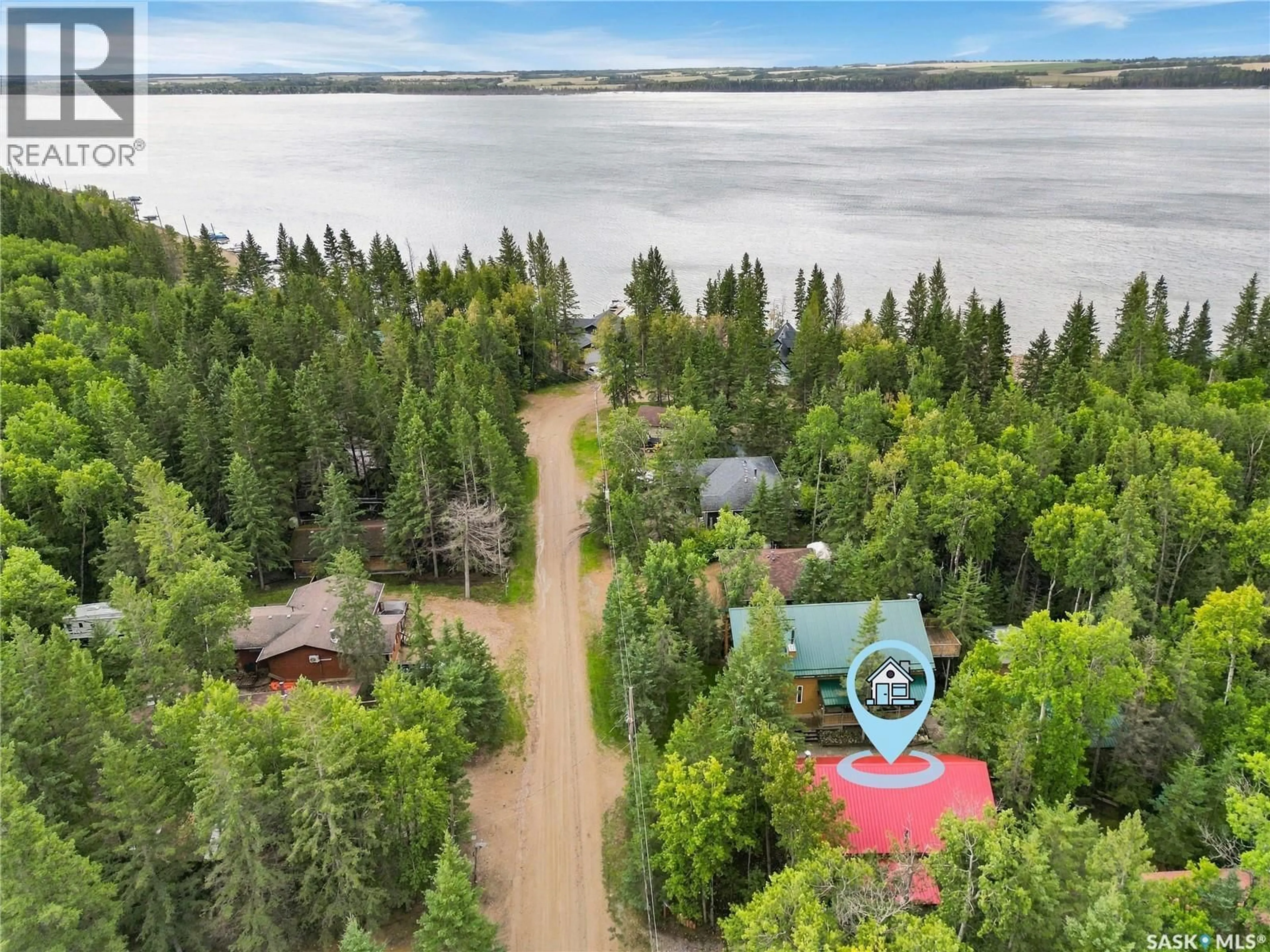 A pic from outside/outdoor area/front of a property/back of a property/a pic from drone, water/lake/river/ocean view for 301 ASPEN DRIVE, Meeting Lake Saskatchewan S0M2L0