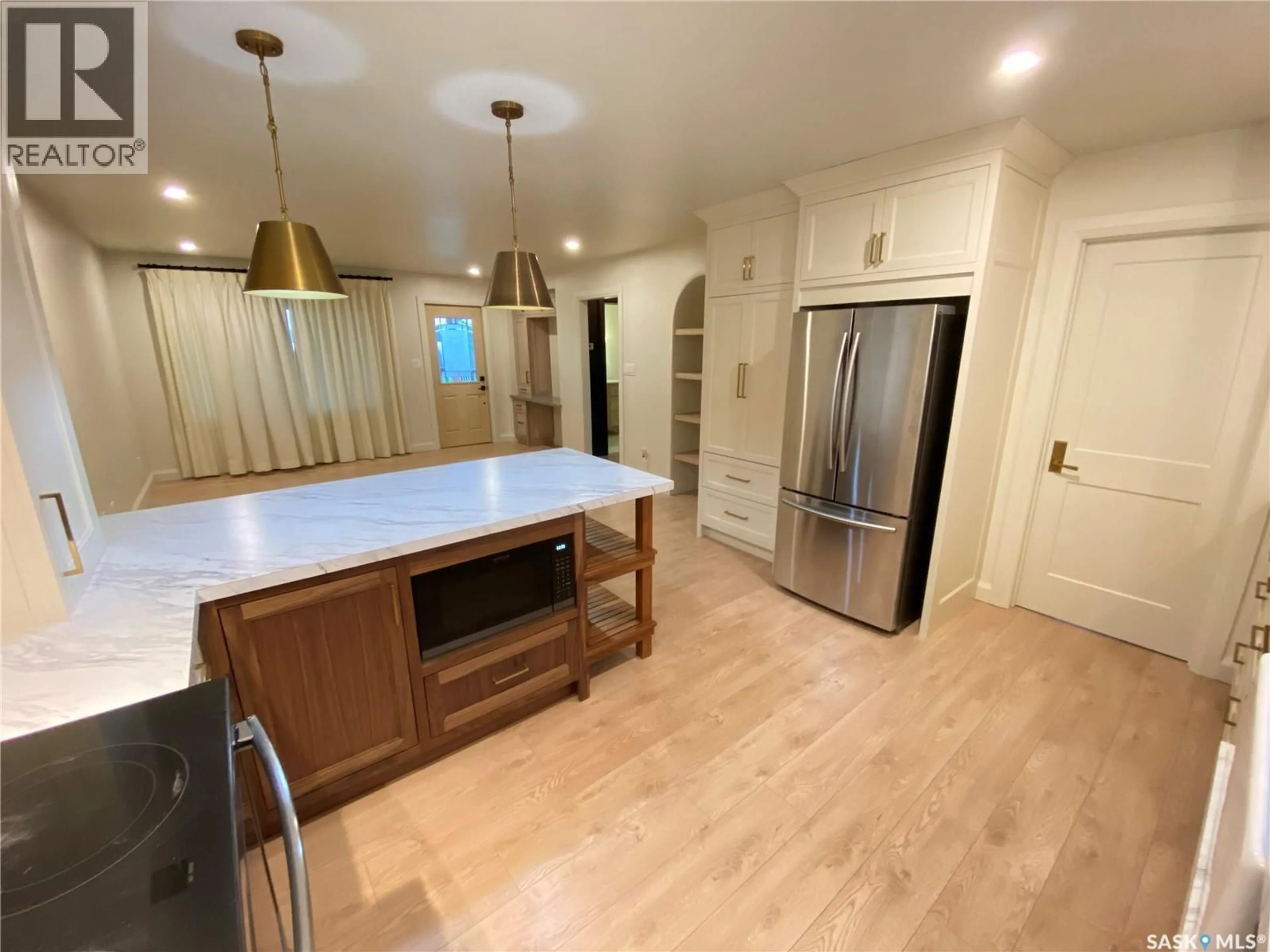 Open concept kitchen, wood/laminate floor for 324 SULLY AVENUE, Orkney Rm No. 244 Saskatchewan S4N4K1