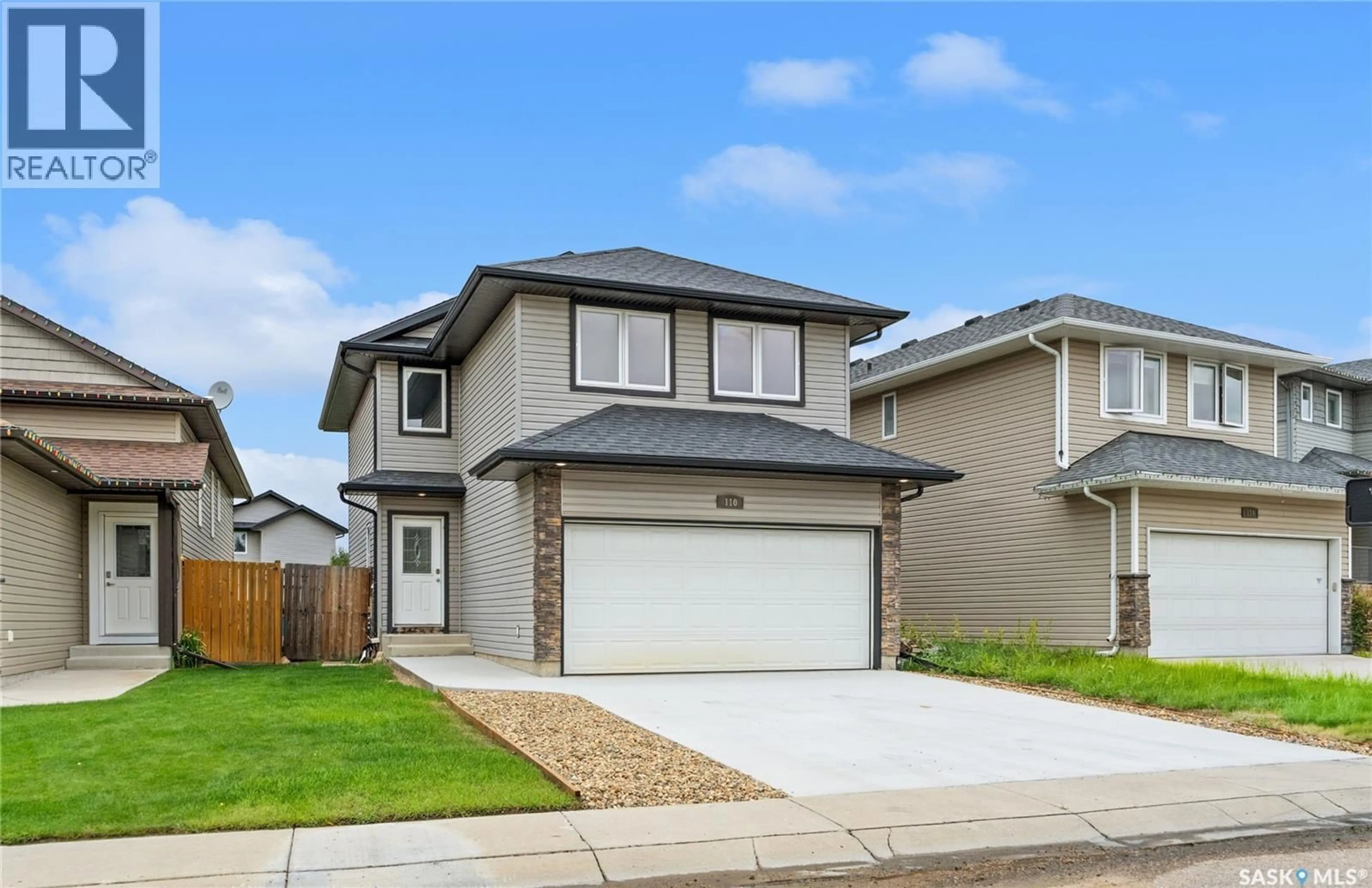 Home with vinyl exterior material, street for 110 HENICK CRESCENT, Saskatoon Saskatchewan S7R0A7