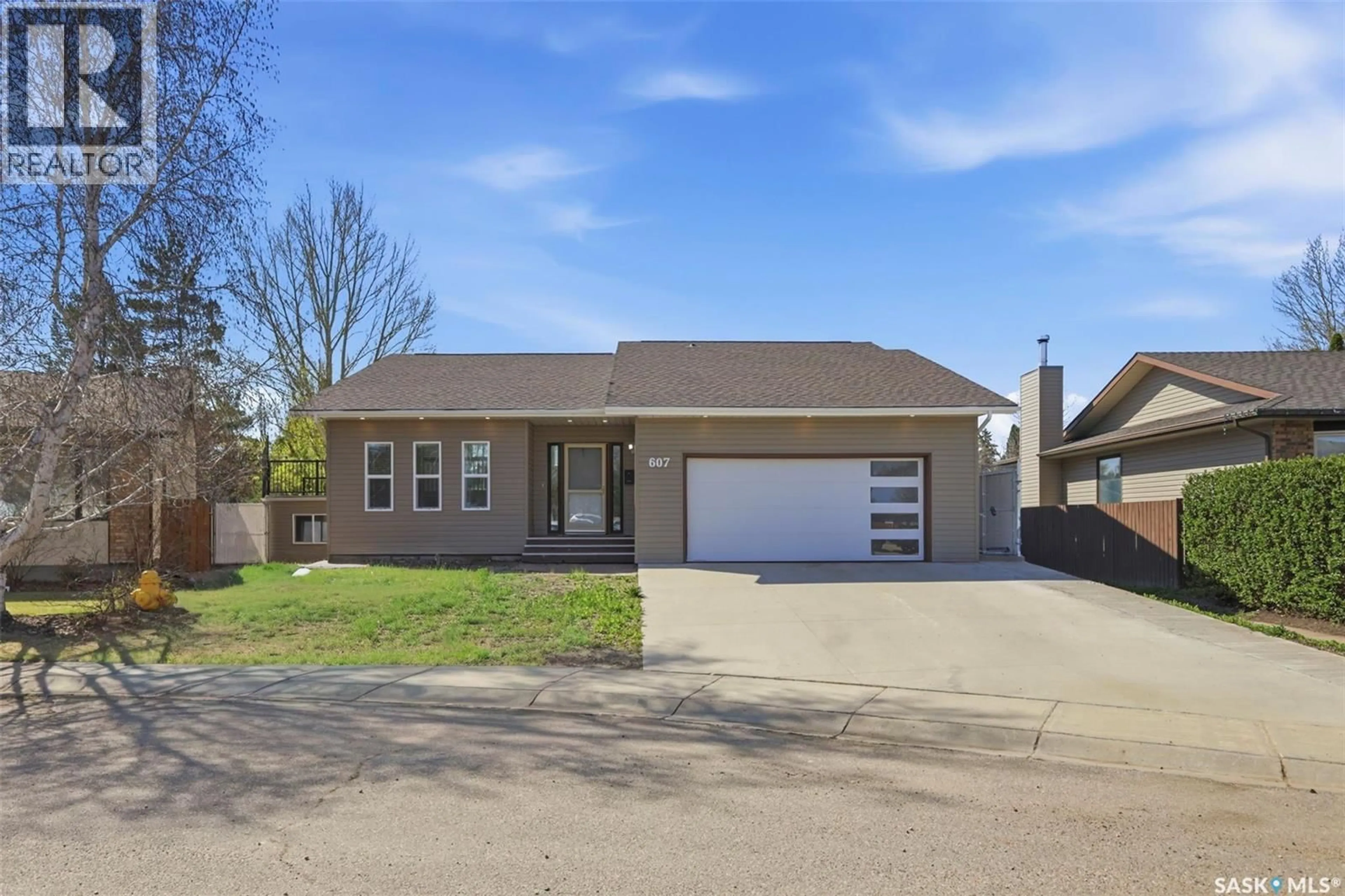 Home with vinyl exterior material, street for 607 ADDIE CRESCENT, Saskatoon Saskatchewan S7N3K7