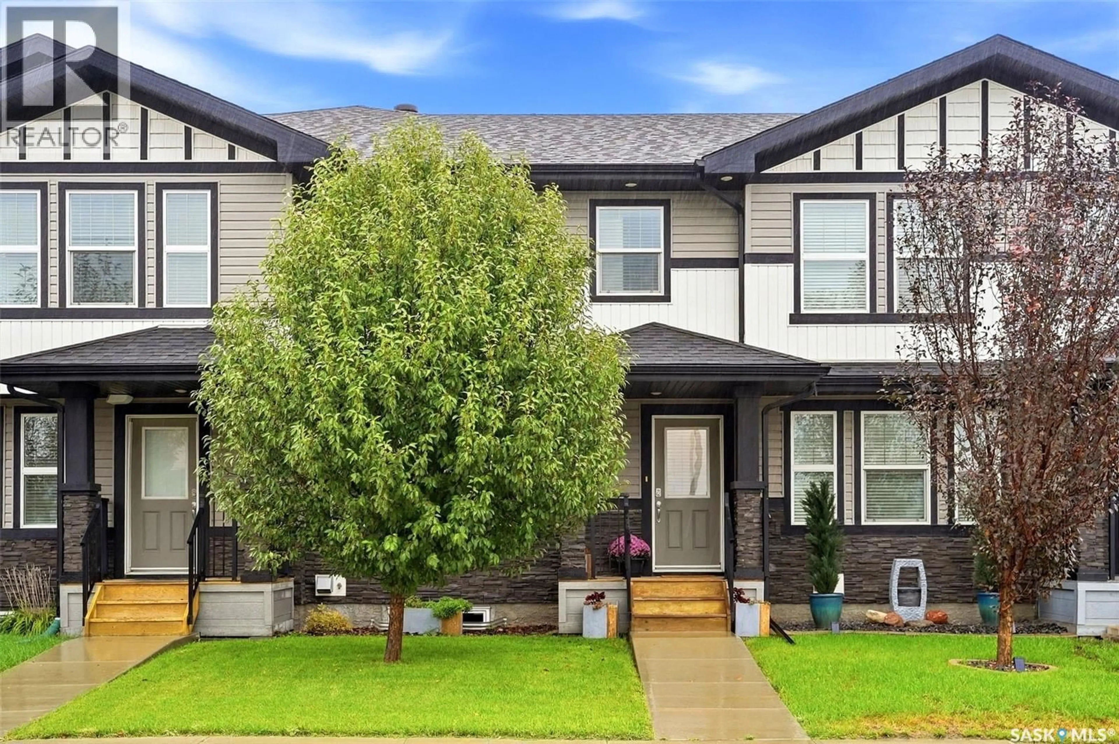 Home with vinyl exterior material, street for 8008 CANOLA AVENUE, Regina Saskatchewan S4Y0E7