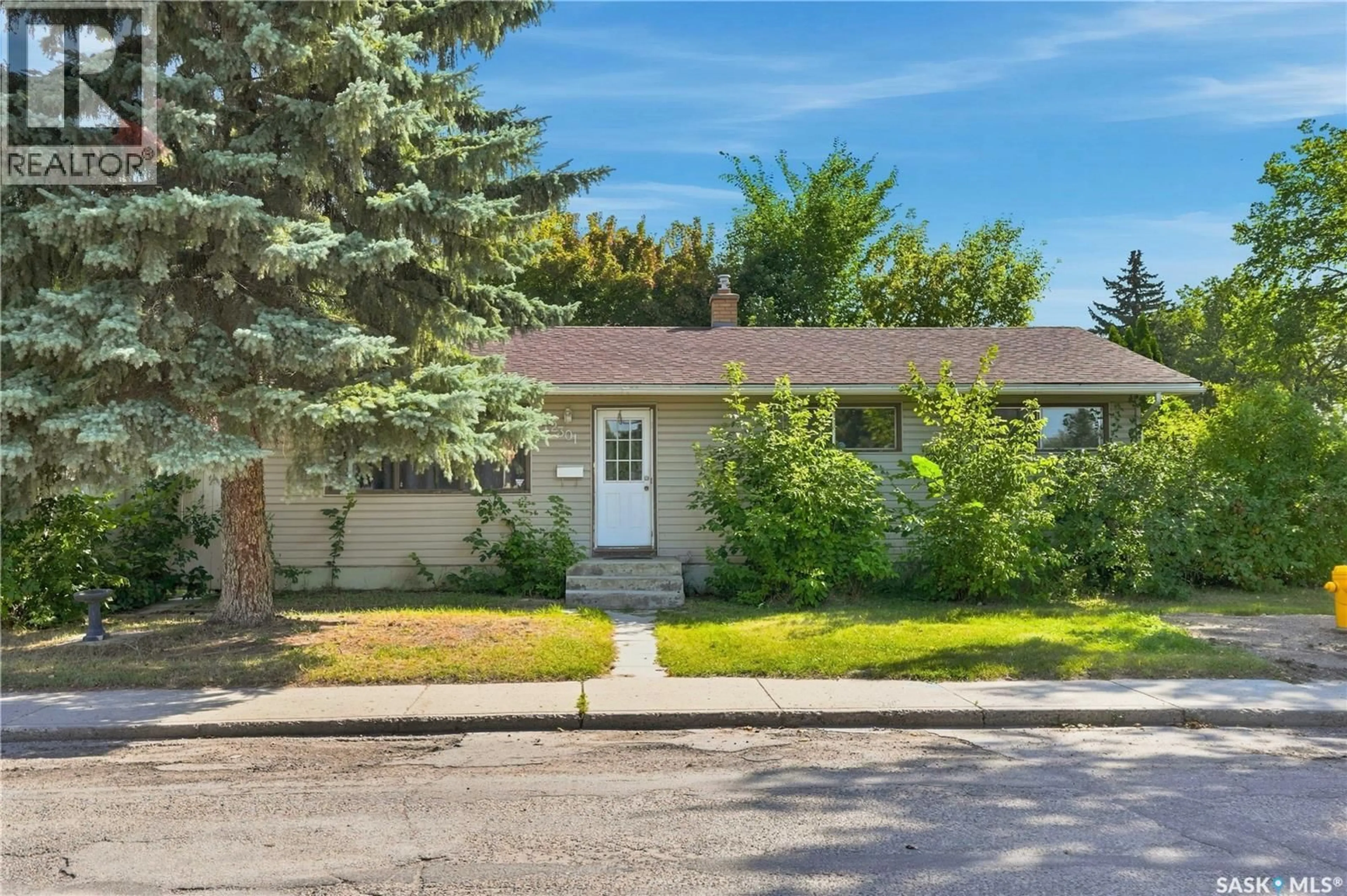 Home with vinyl exterior material, street for 2301 TAYLOR STREET, Saskatoon Saskatchewan S7H1W8