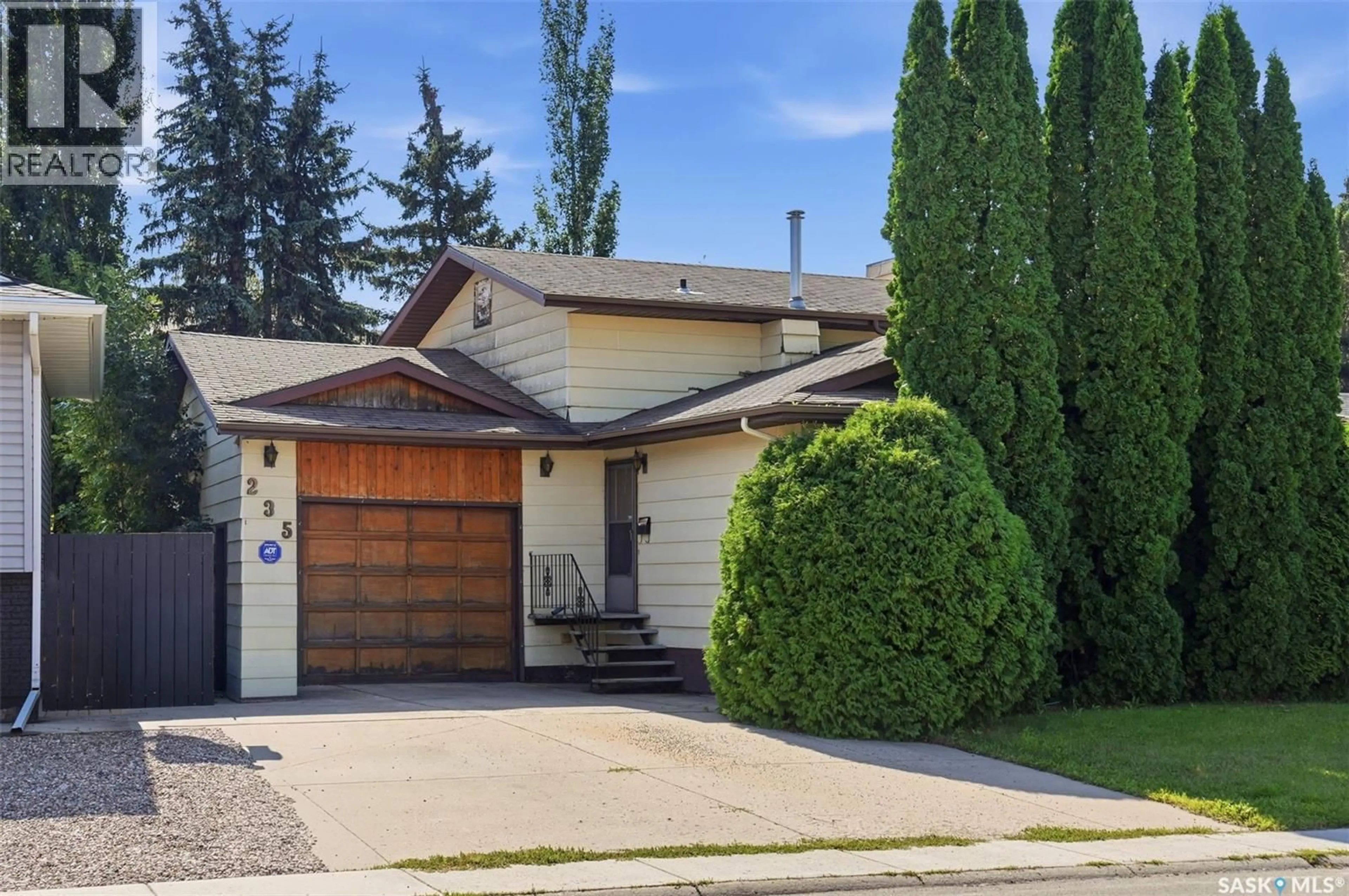 Home with vinyl exterior material, street for 235 MEILICKE ROAD, Saskatoon Saskatchewan S7K5V6