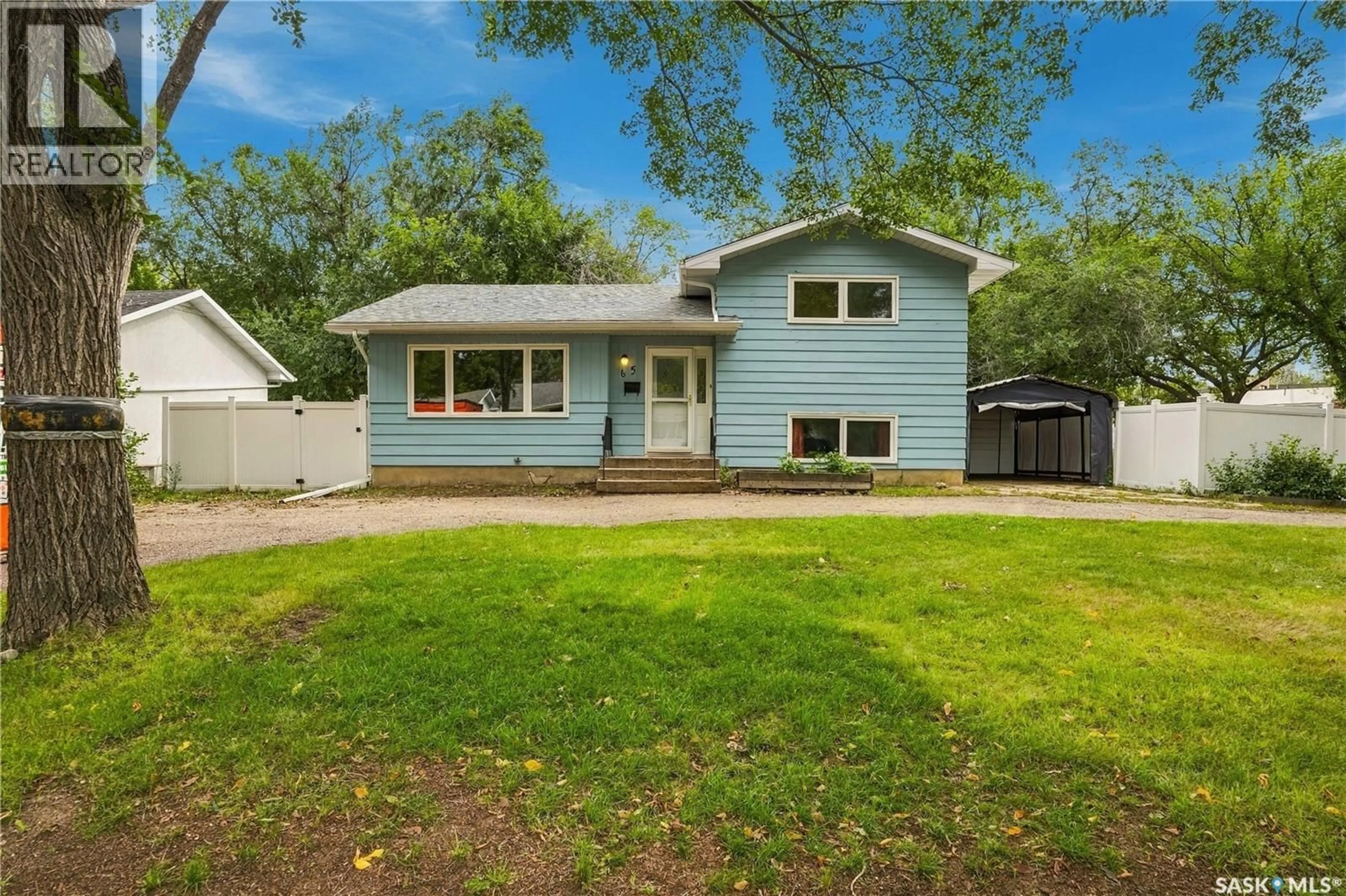 Home with vinyl exterior material, street for 65 BOBOLINK BAY, Regina Saskatchewan S4S4K2
