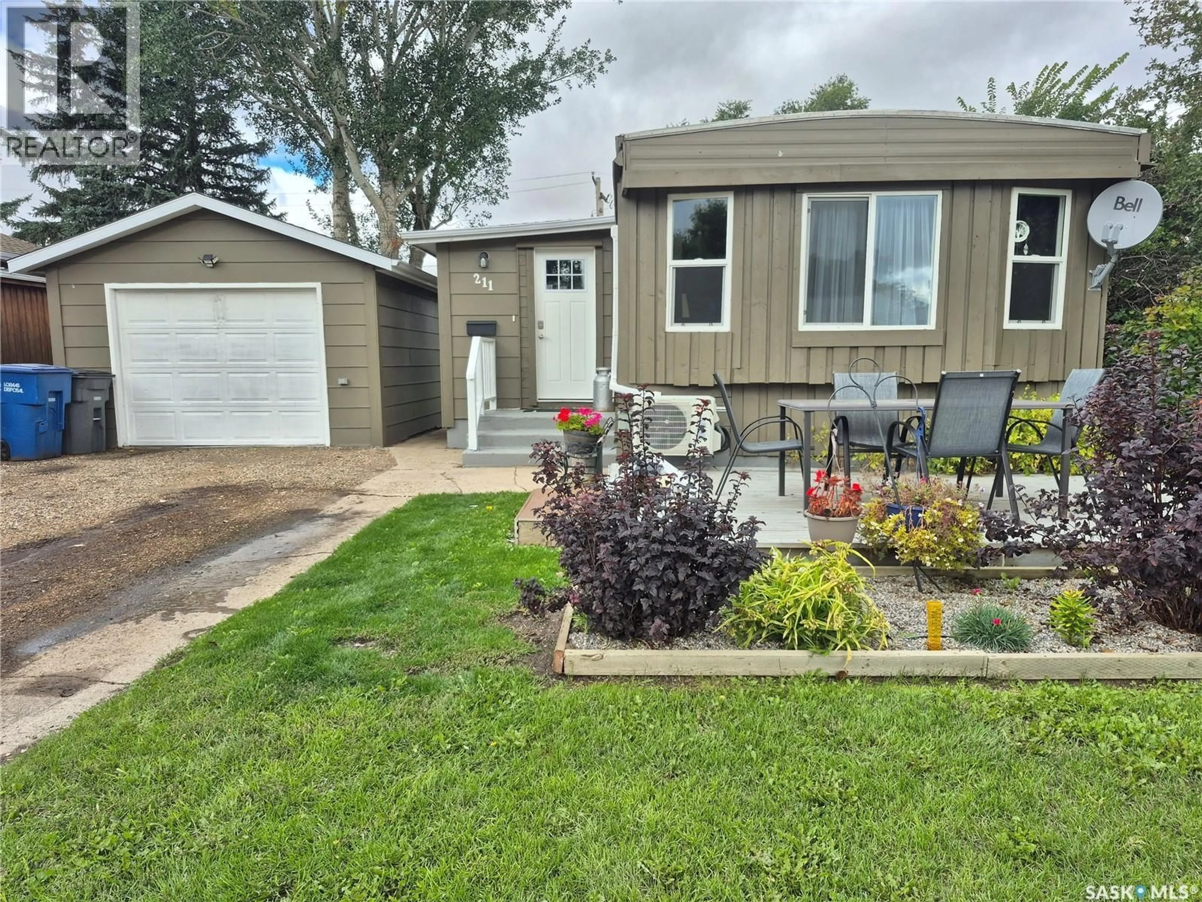 Home with vinyl exterior material, street for 211 PRAIRIE STREET, Yellow Grass Saskatchewan S0G5J0