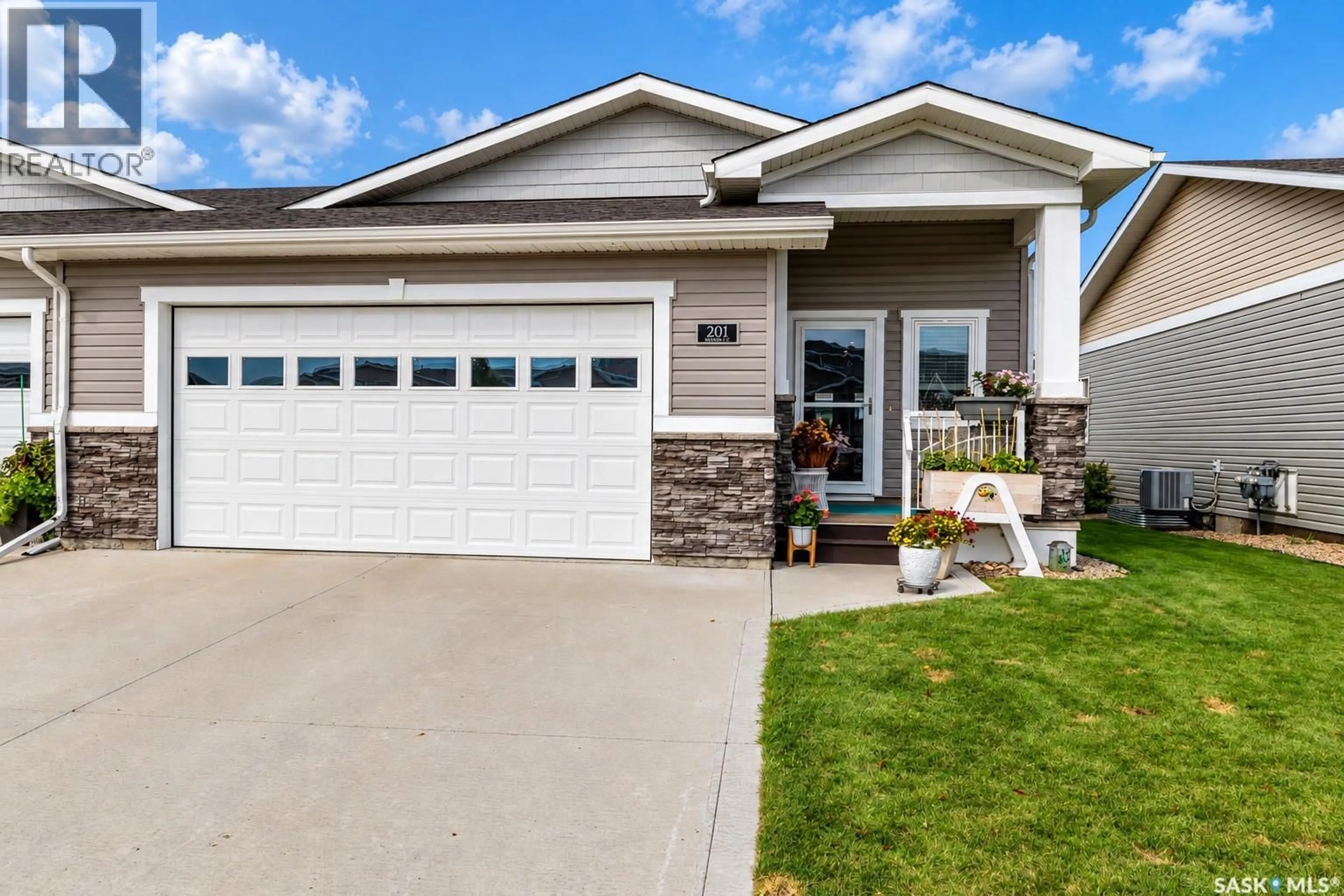 Home with vinyl exterior material, street for 201 BRADLEY STREET, Moose Jaw Saskatchewan S6H5Y4