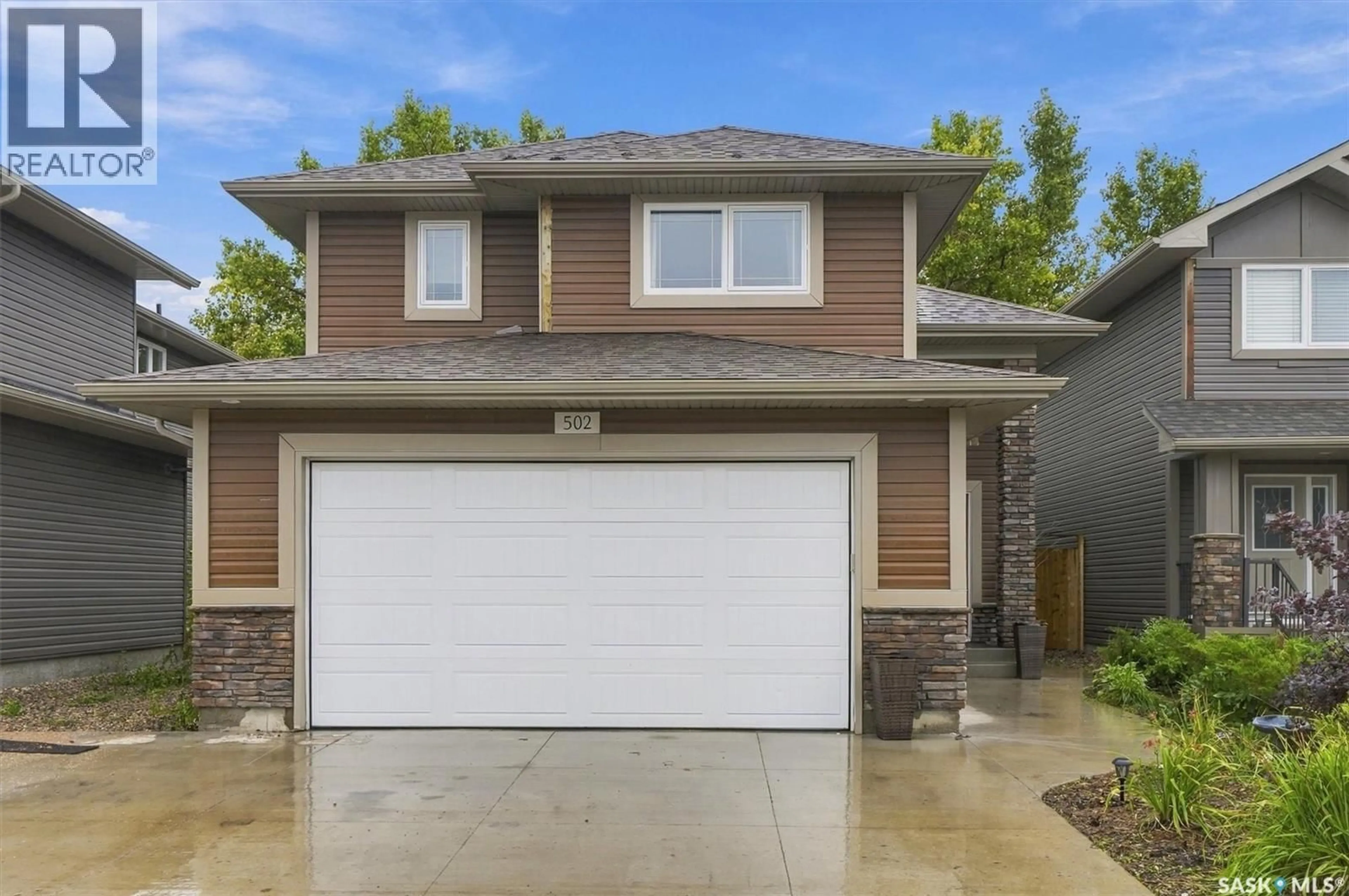 Home with vinyl exterior material, street for 502 LEHRER CRESCENT, Saskatoon Saskatchewan S7R0L3