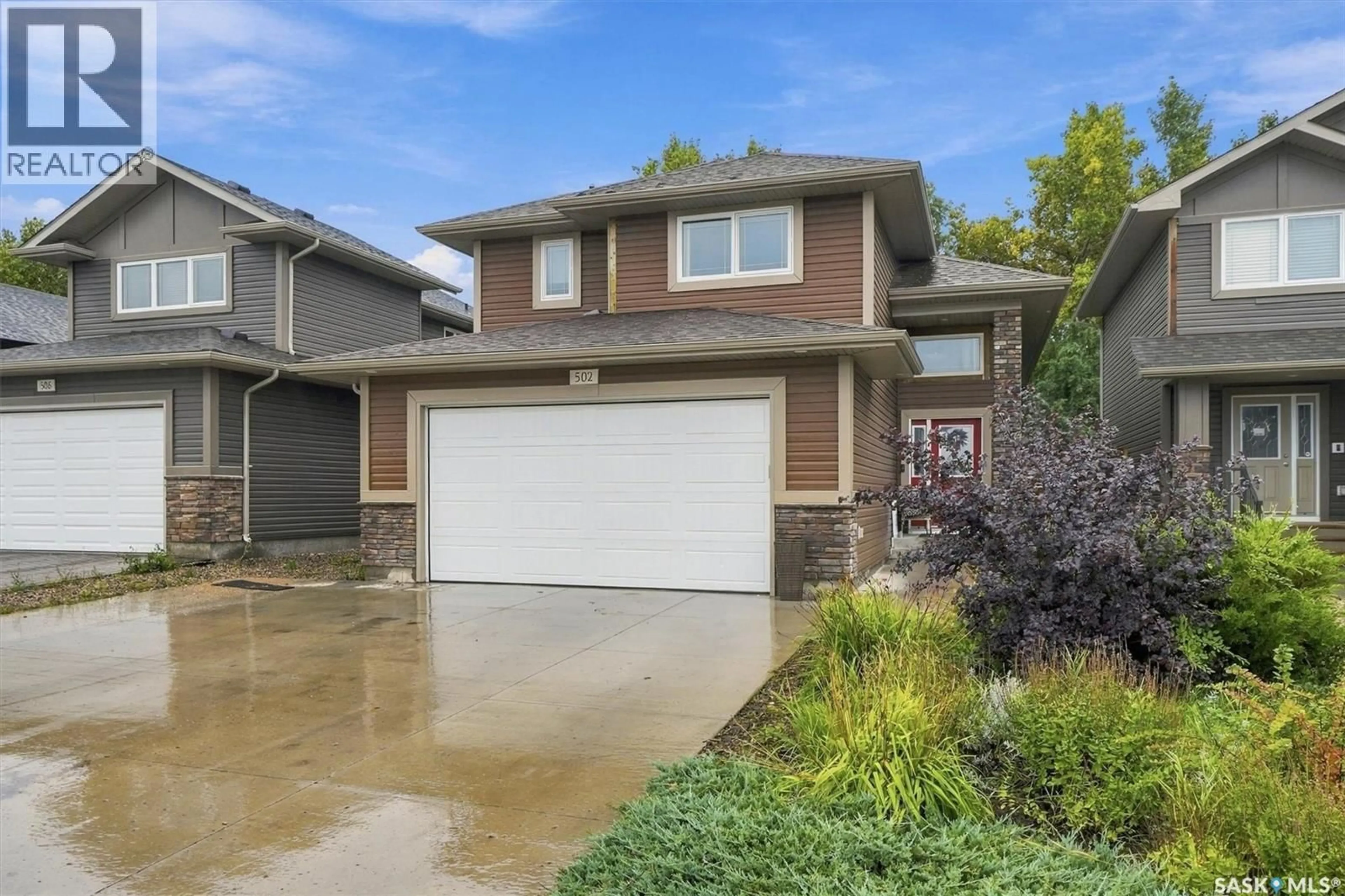 Home with vinyl exterior material, street for 502 LEHRER CRESCENT, Saskatoon Saskatchewan S7R0L3