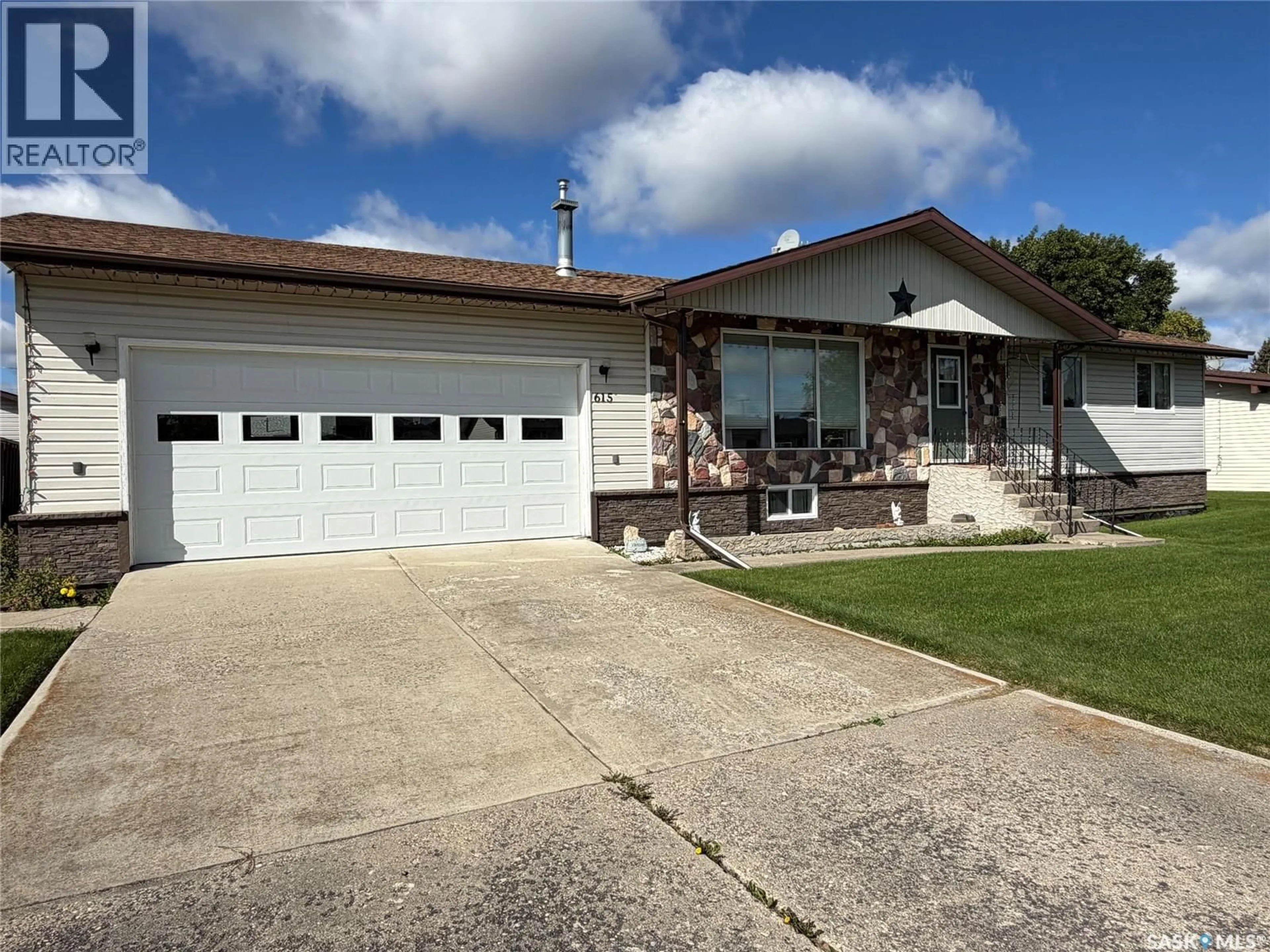 Home with vinyl exterior material, street for 615 MAIN STREET, Hudson Bay Saskatchewan S0E0Y0