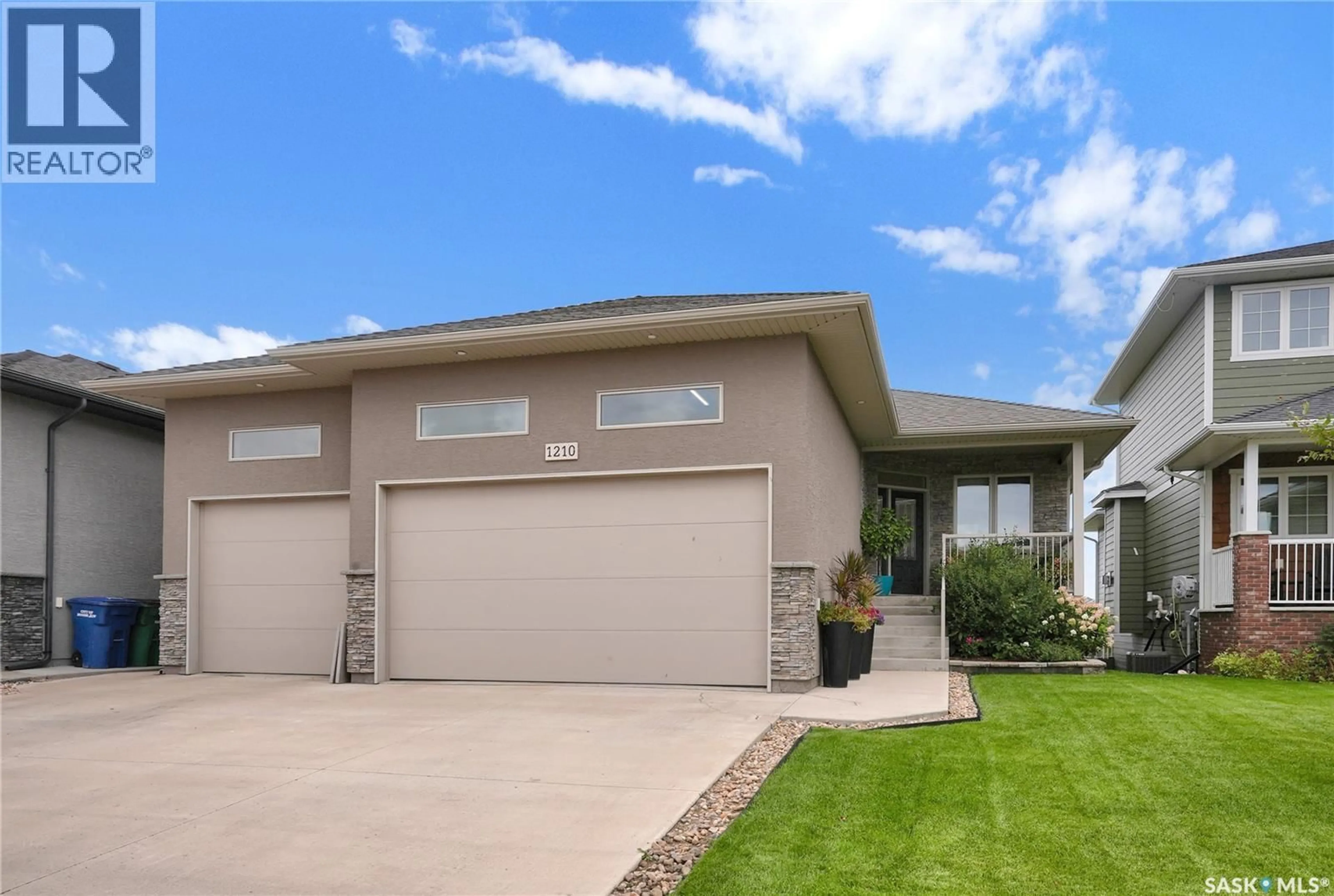 Home with vinyl exterior material, street for 1210 MEIER DRIVE, Moose Jaw Saskatchewan S6J0B2