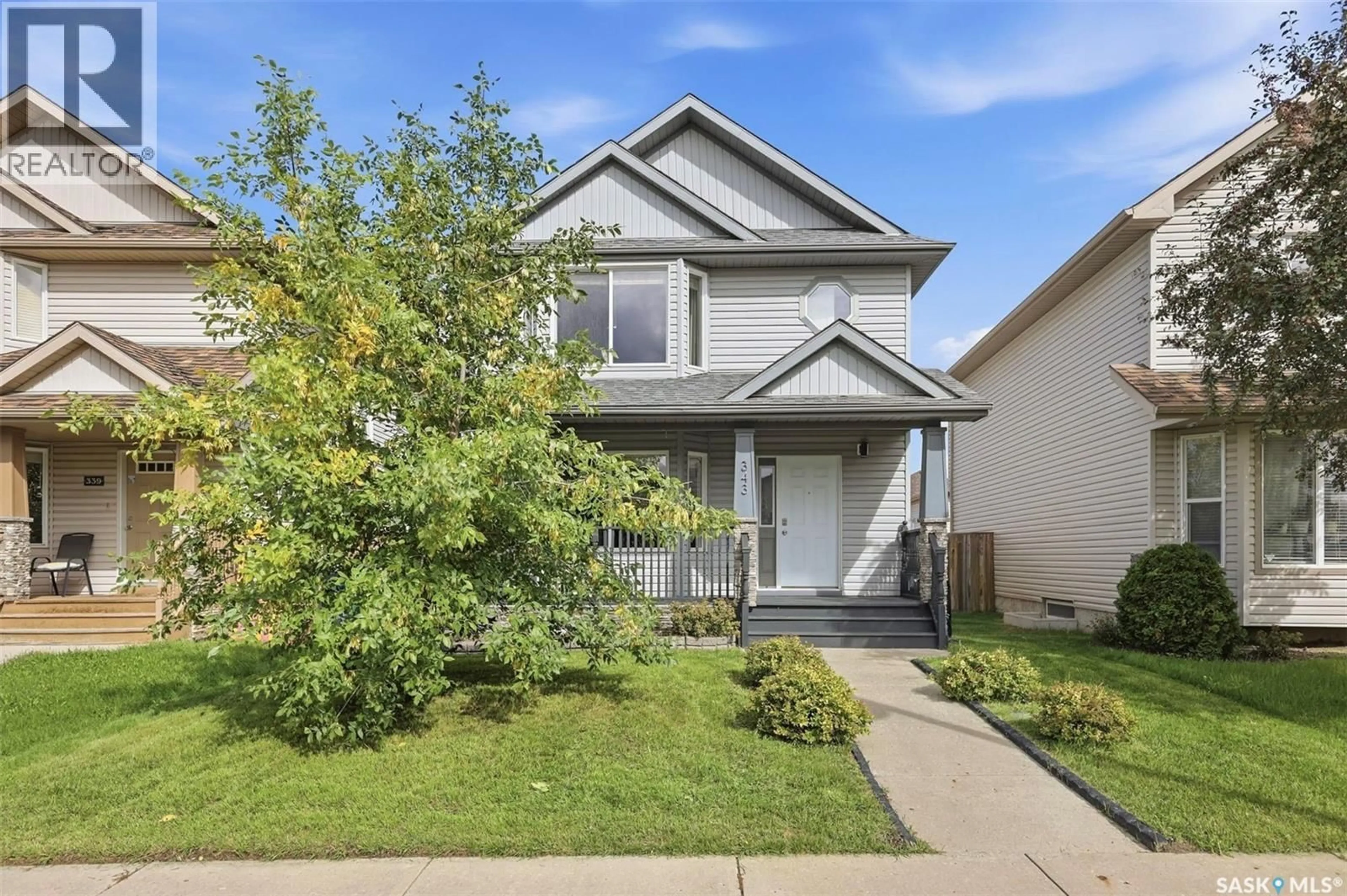 Home with vinyl exterior material, street for 343 GORDON ROAD, Saskatoon Saskatchewan S7T0A1