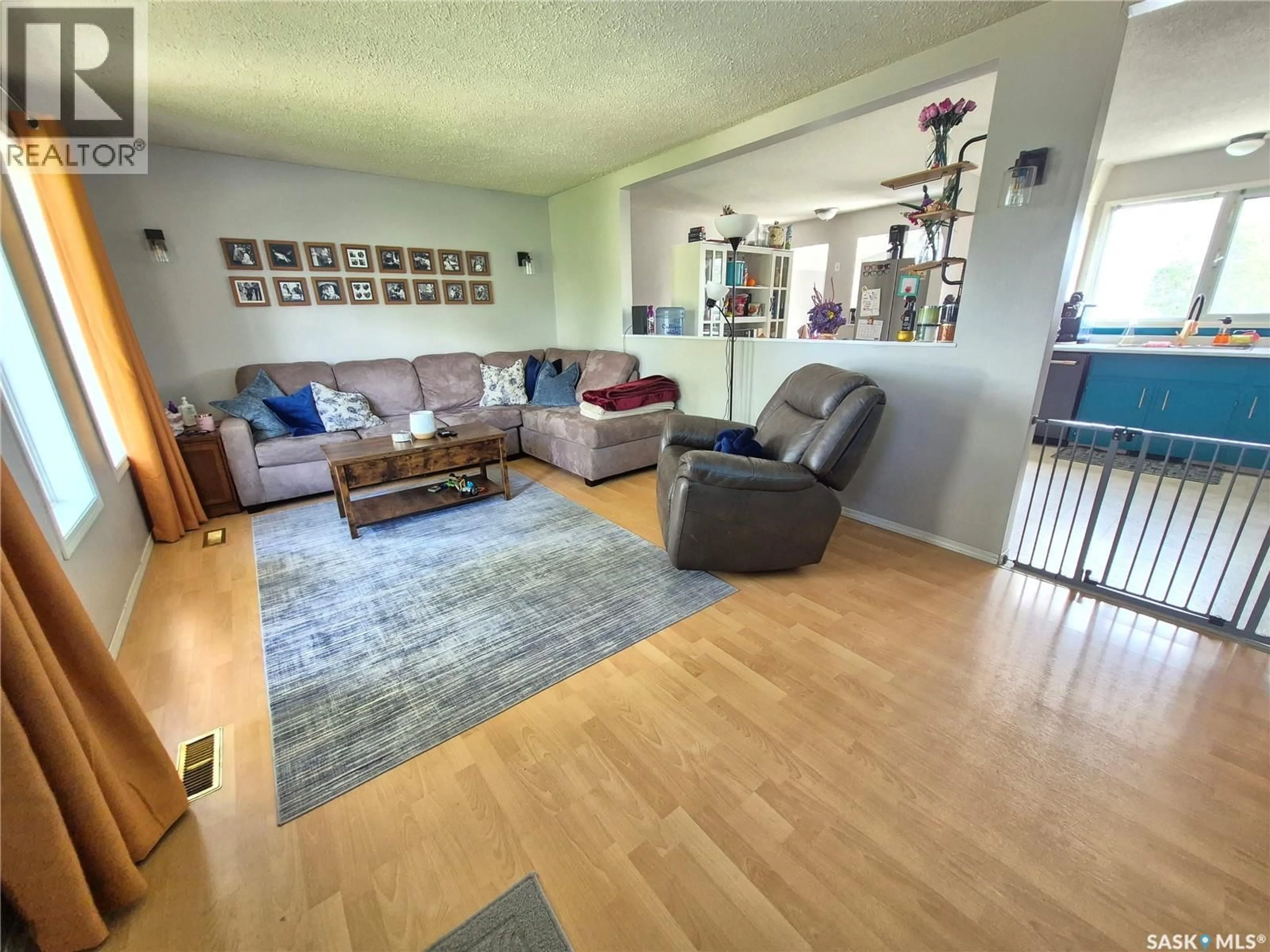 Living room with furniture, unknown for 32 METHERAL BAY, Weyburn Saskatchewan S4H2M6
