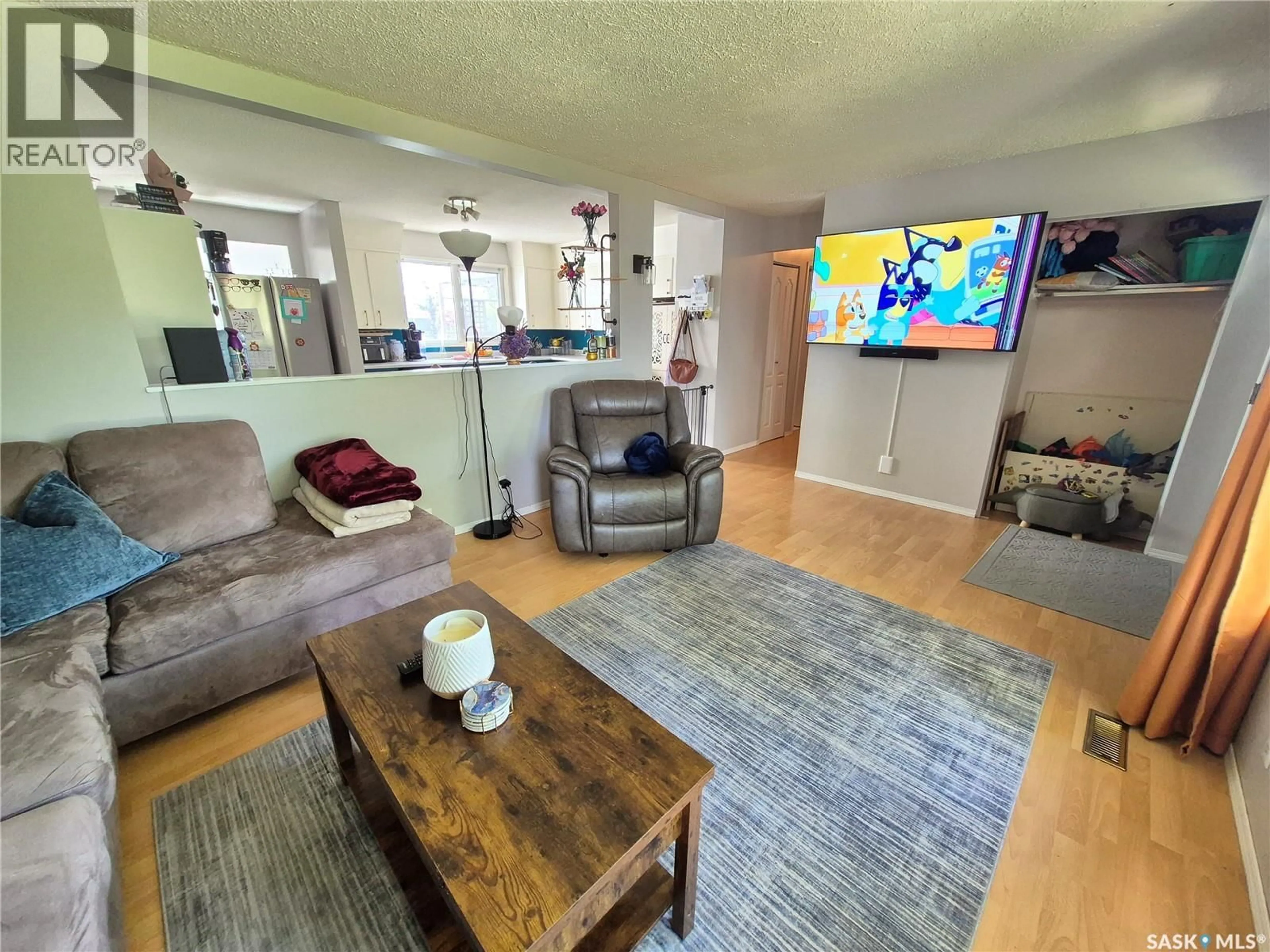 Living room with furniture, unknown for 32 METHERAL BAY, Weyburn Saskatchewan S4H2M6