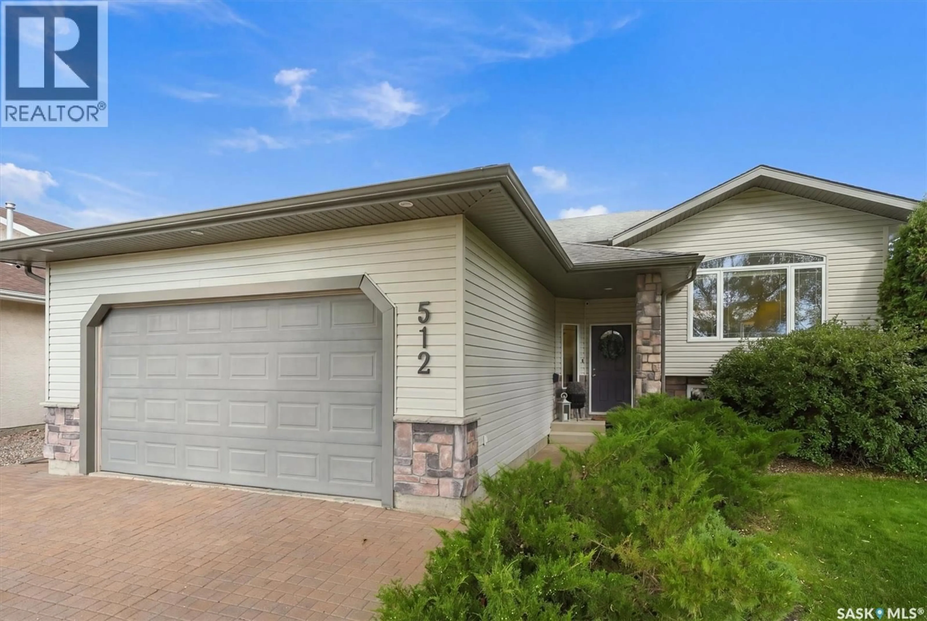 Home with brick exterior material, street for 512 ENS CRESCENT, Warman Saskatchewan S0K4S0