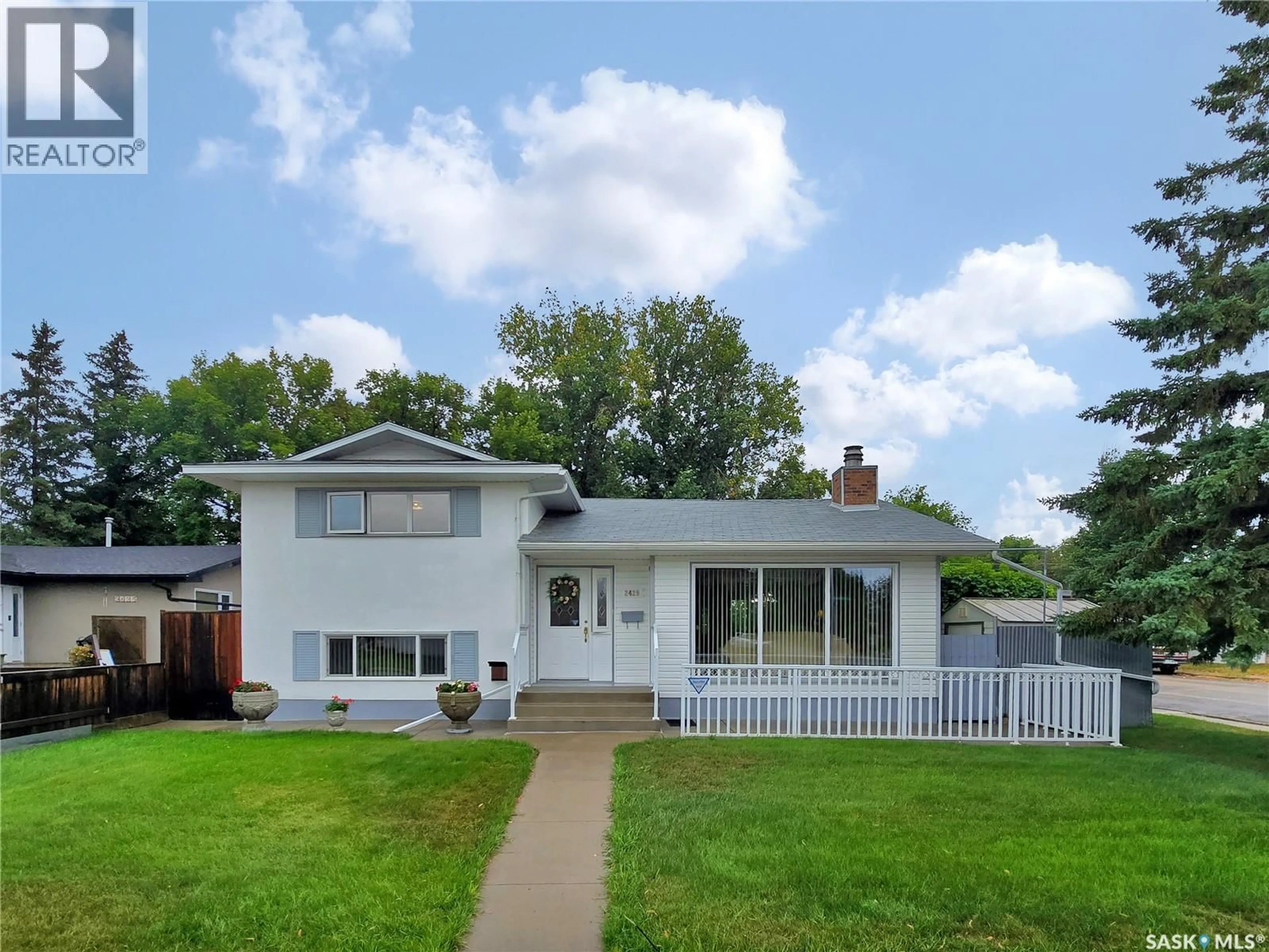 Home with vinyl exterior material, street for 2429 CUMBERLAND AVENUE, Saskatoon Saskatchewan S7J1Z8
