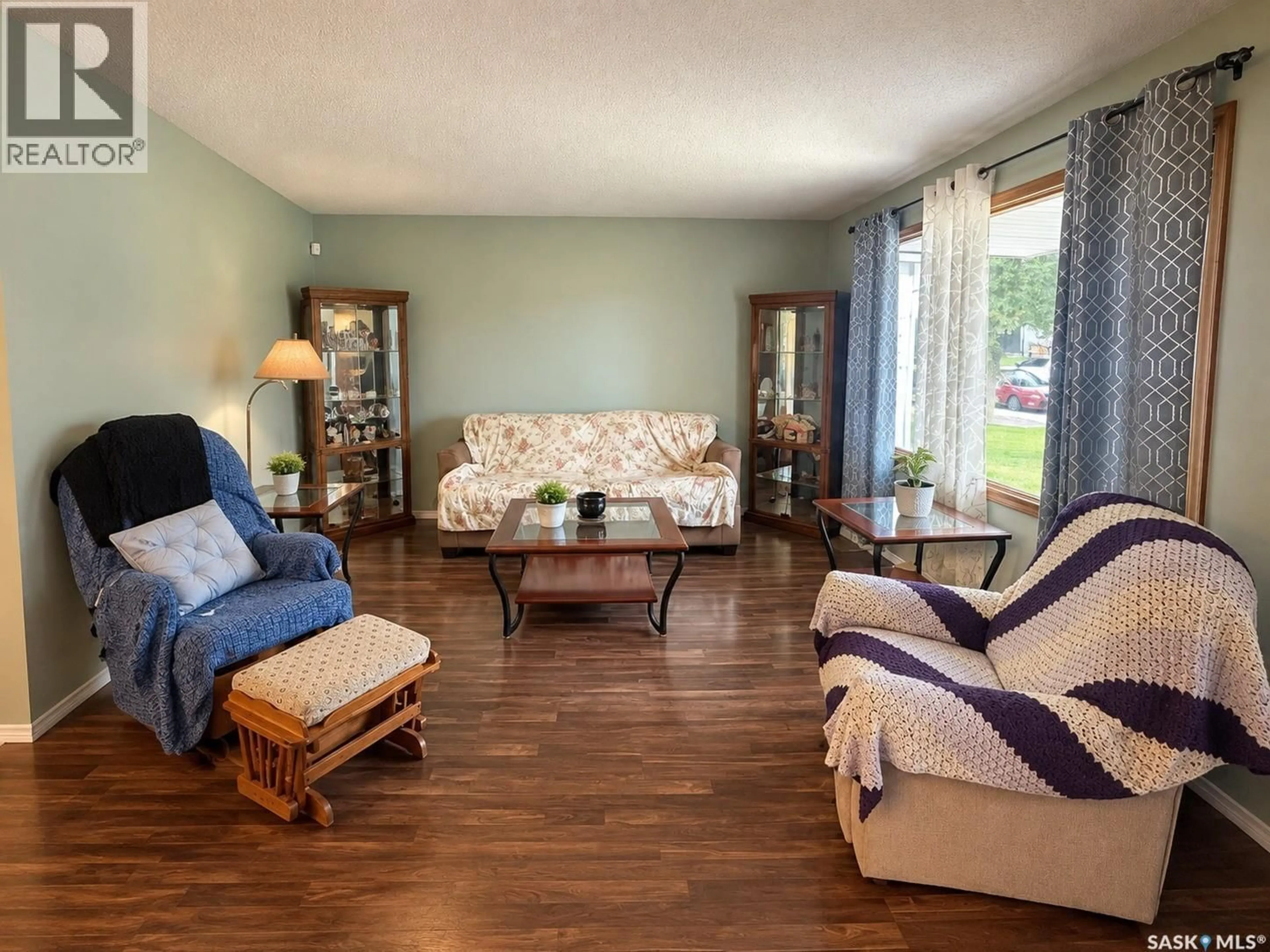 Living room with furniture, wood/laminate floor for 2754 MACKAY STREET, Regina Saskatchewan S4R1A6
