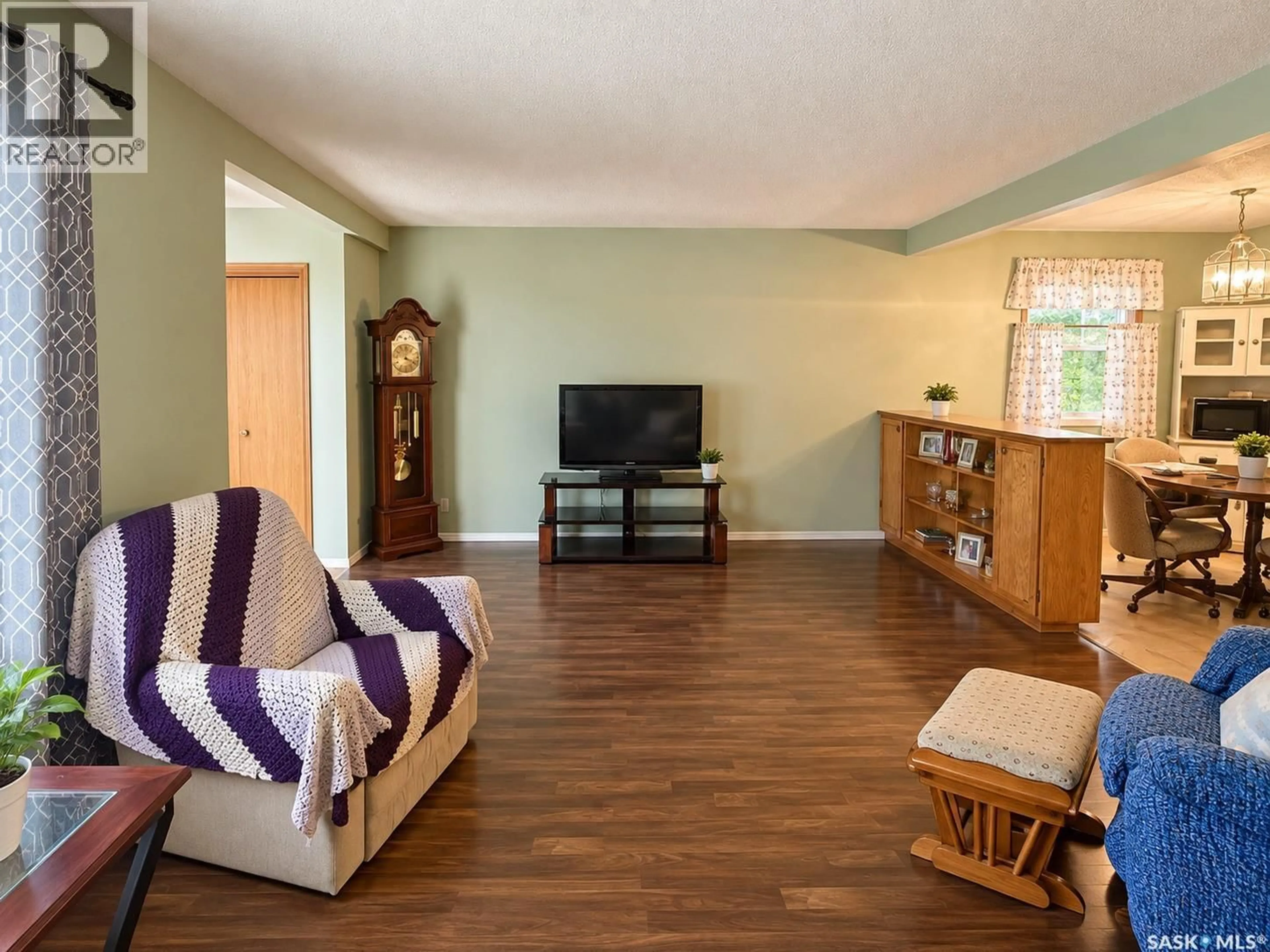 Living room with furniture, wood/laminate floor for 2754 MACKAY STREET, Regina Saskatchewan S4R1A6