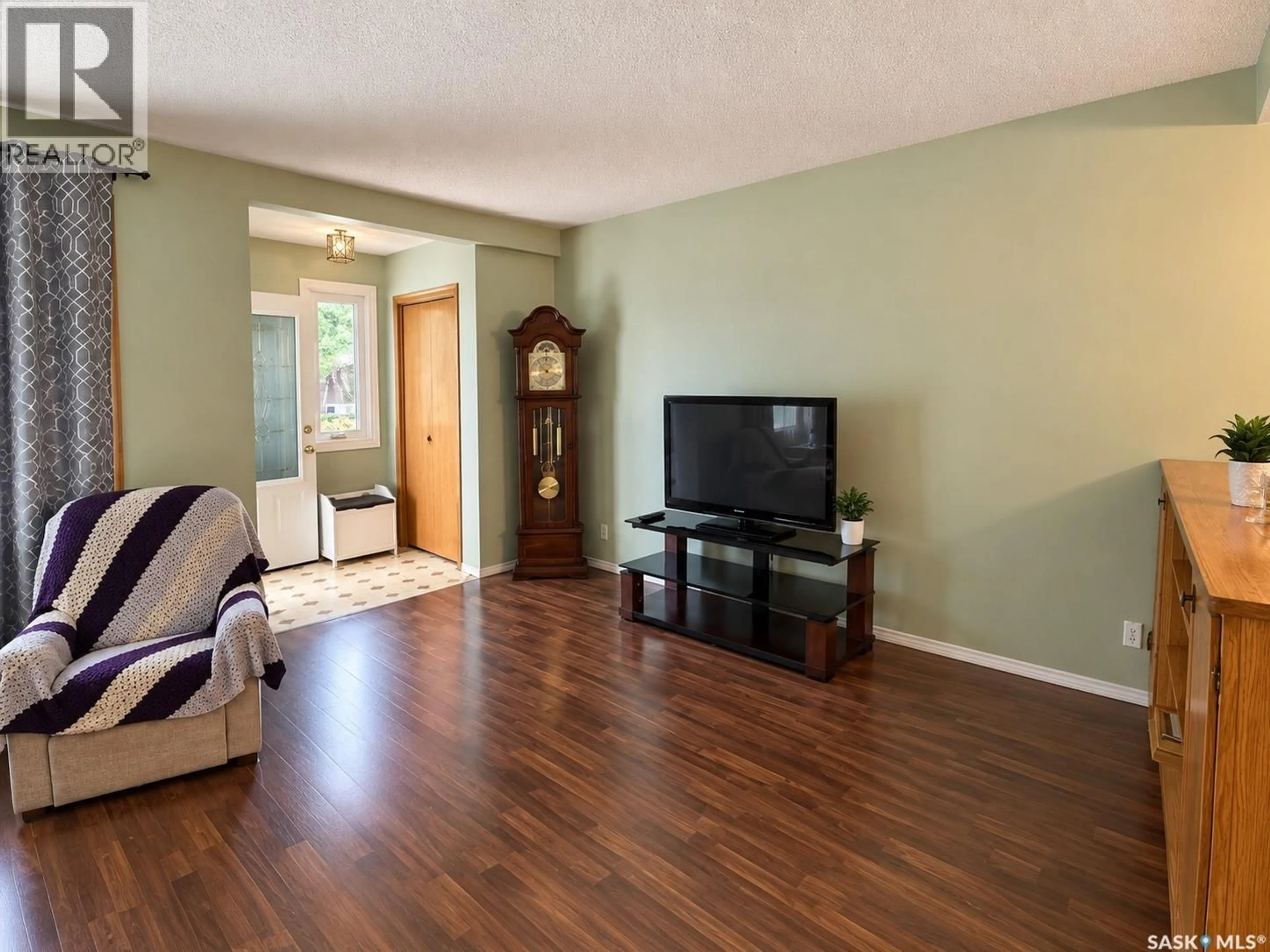 Living room with furniture, wood/laminate floor for 2754 MACKAY STREET, Regina Saskatchewan S4R1A6