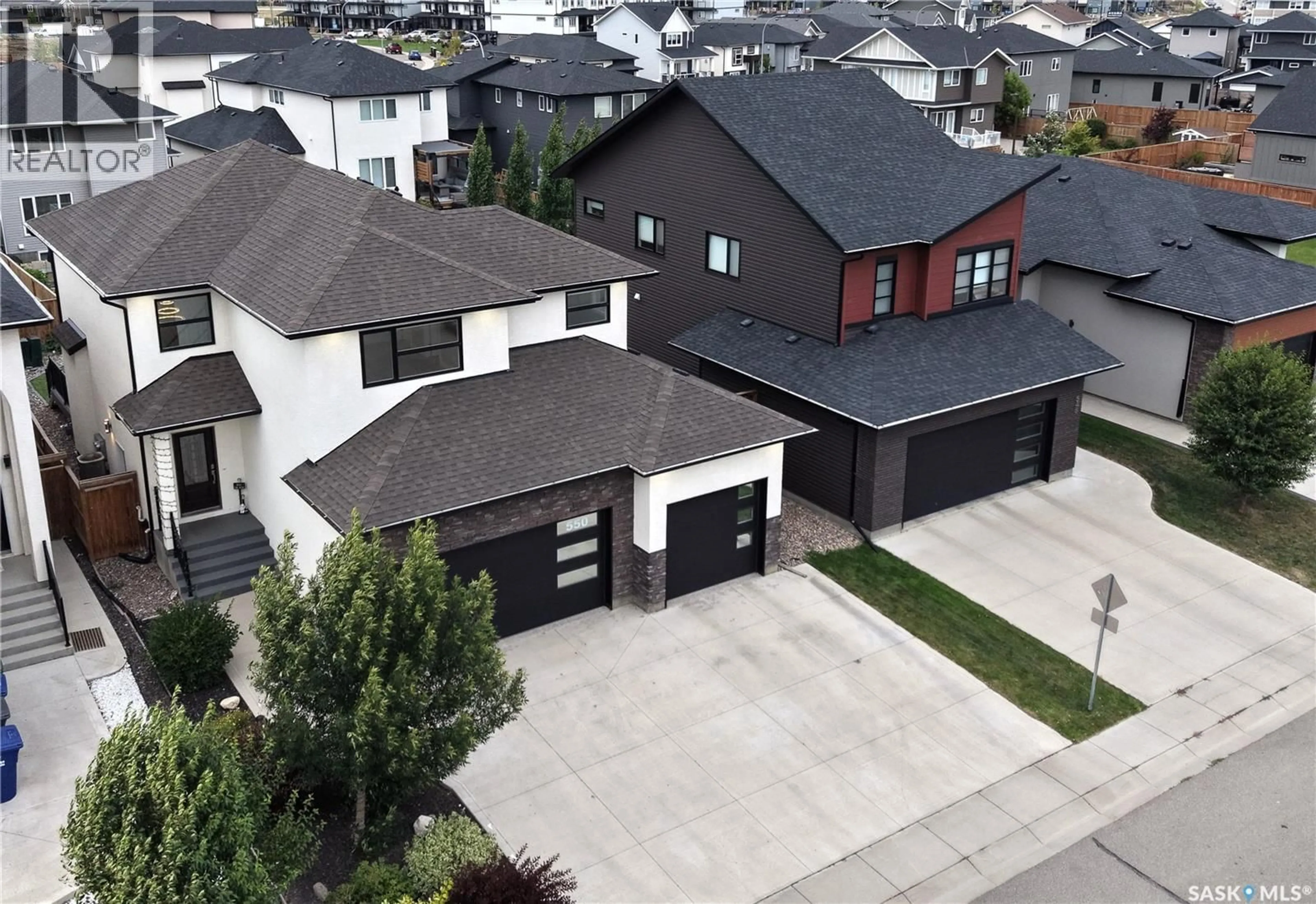 A pic from outside/outdoor area/front of a property/back of a property/a pic from drone, street for 550 BOLSTAD TURN, Saskatoon Saskatchewan S7W0X9