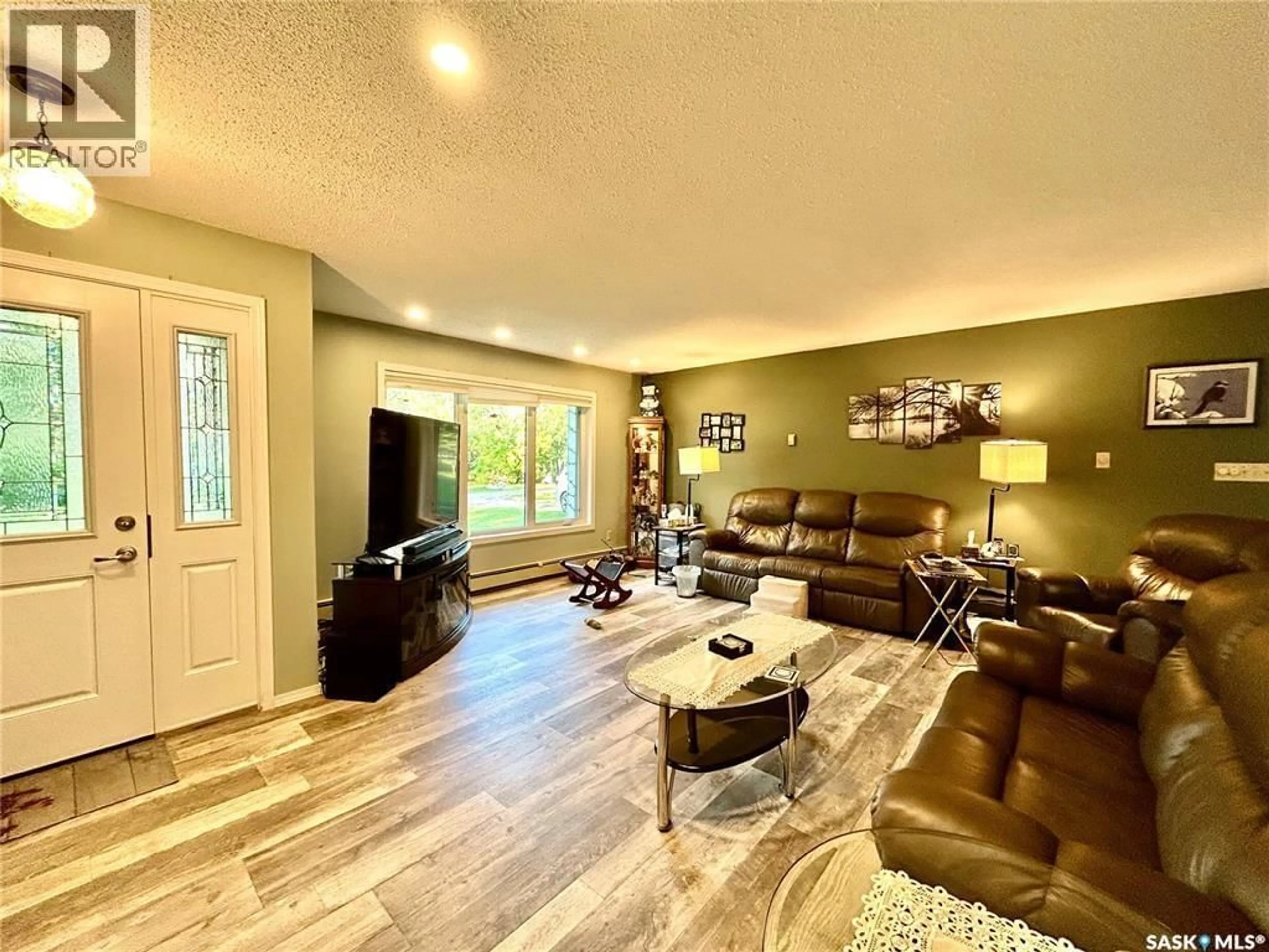 Living room with furniture, wood/laminate floor for CRAGG HOME QUARTER, Arborfield Rm No. 456 Saskatchewan S0E0A0