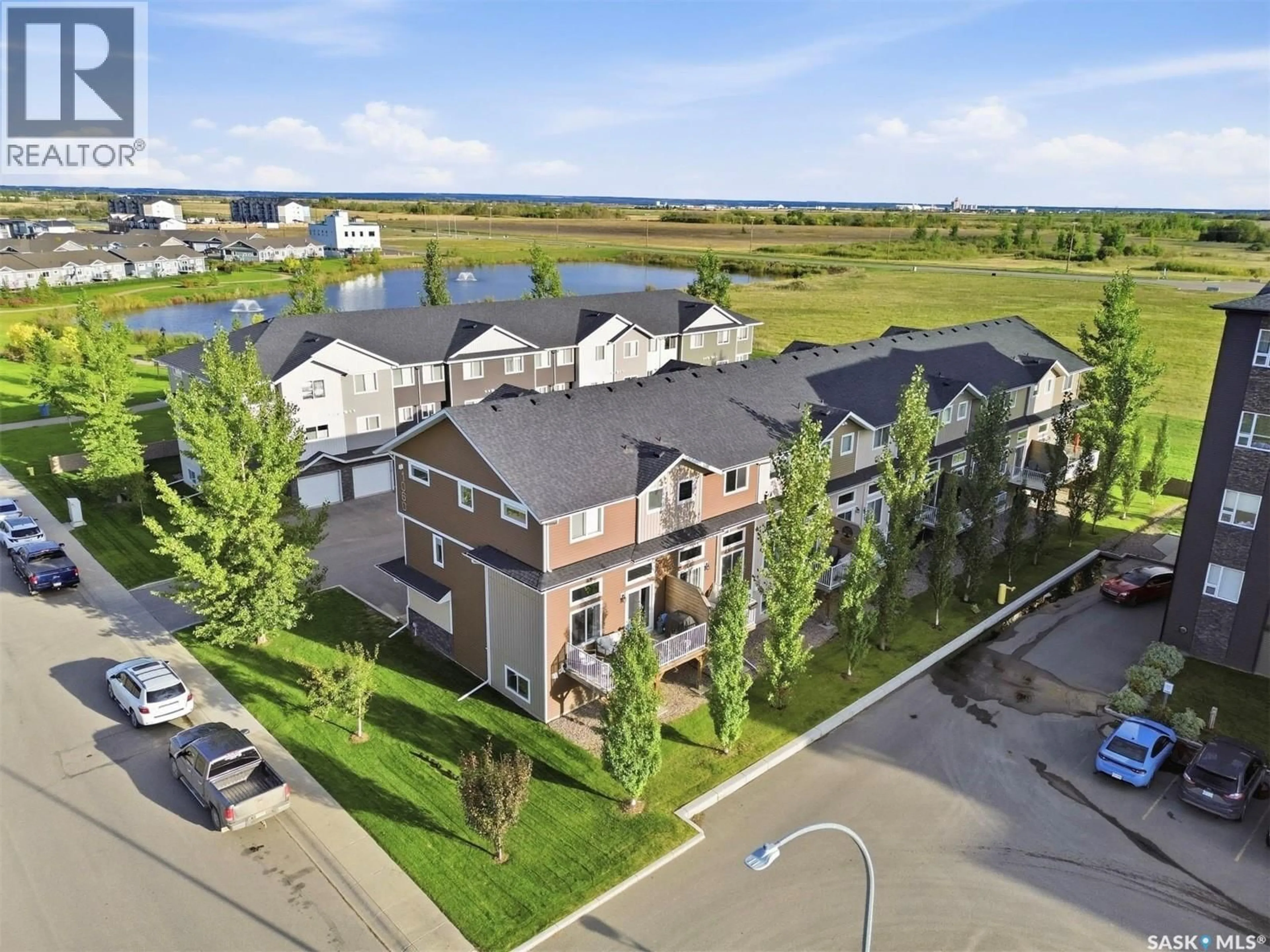 A pic from outside/outdoor area/front of a property/back of a property/a pic from drone, unknown for 1 - 1060 PARR HILL DRIVE, Martensville Saskatchewan S0K2T1