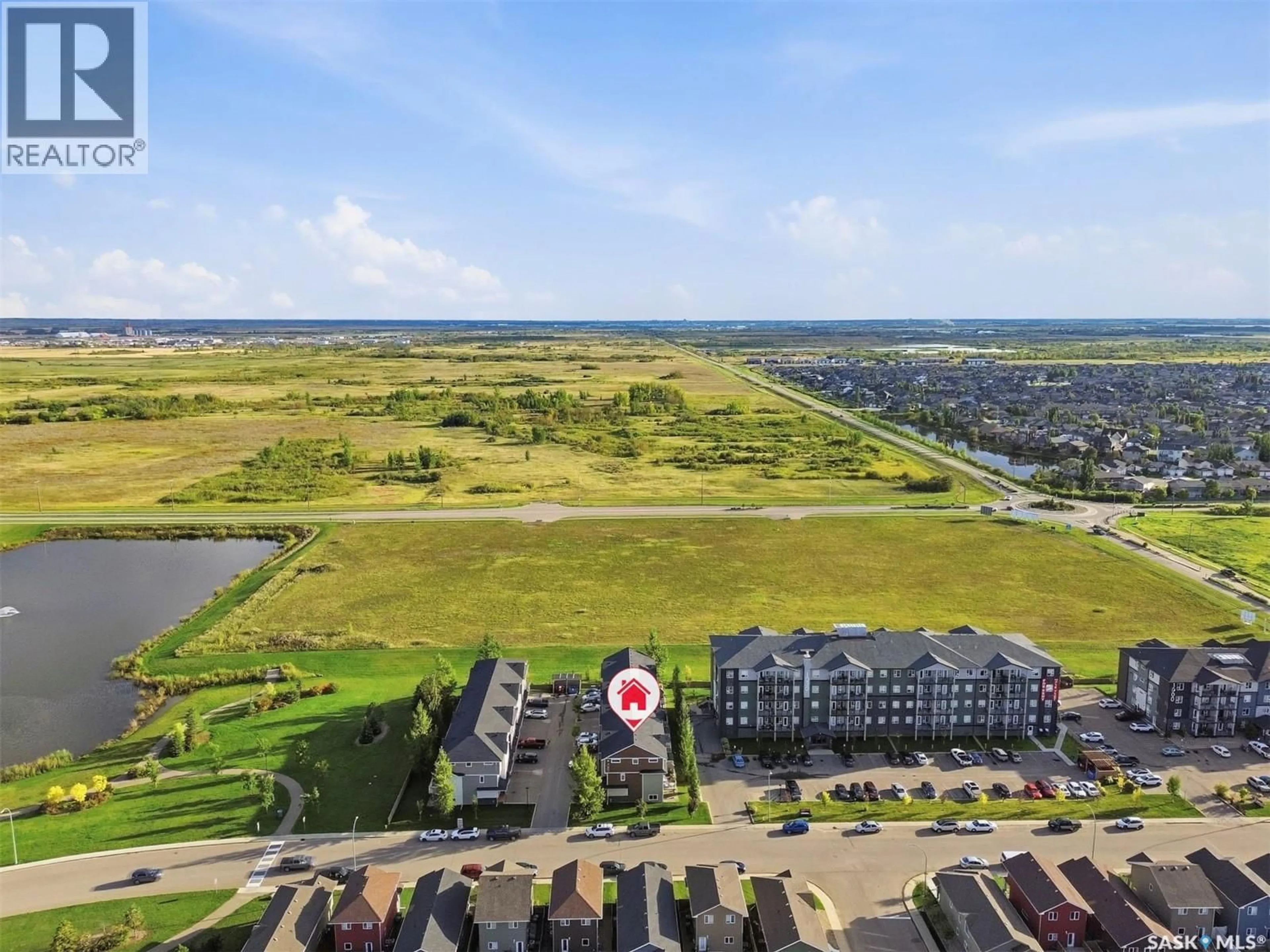 A pic from outside/outdoor area/front of a property/back of a property/a pic from drone, water/lake/river/ocean view for 1 - 1060 PARR HILL DRIVE, Martensville Saskatchewan S0K2T1