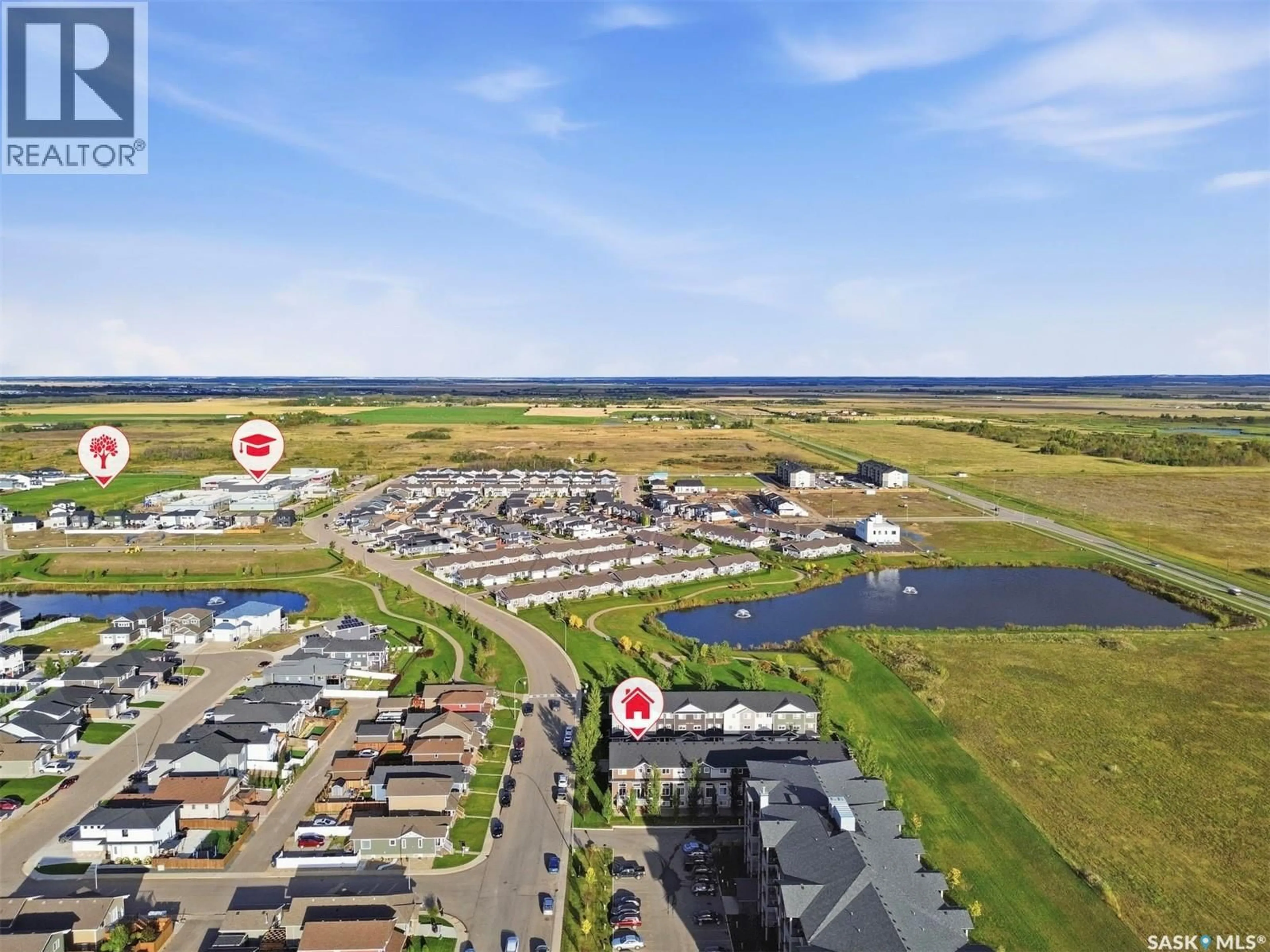 A pic from outside/outdoor area/front of a property/back of a property/a pic from drone, water/lake/river/ocean view for 1 - 1060 PARR HILL DRIVE, Martensville Saskatchewan S0K2T1