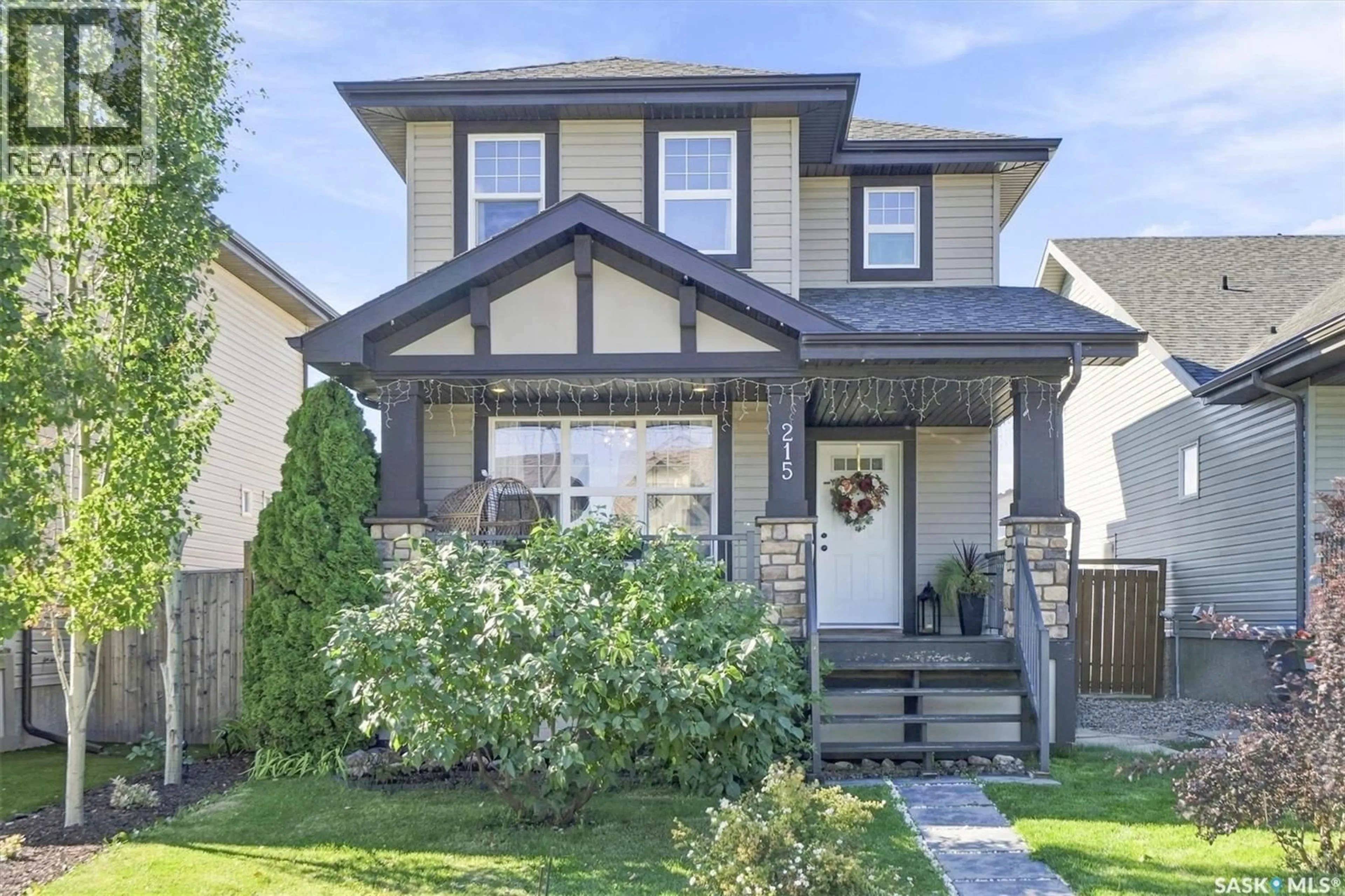 Home with vinyl exterior material, street for 215 COAD MANOR, Saskatoon Saskatchewan S7R0A7