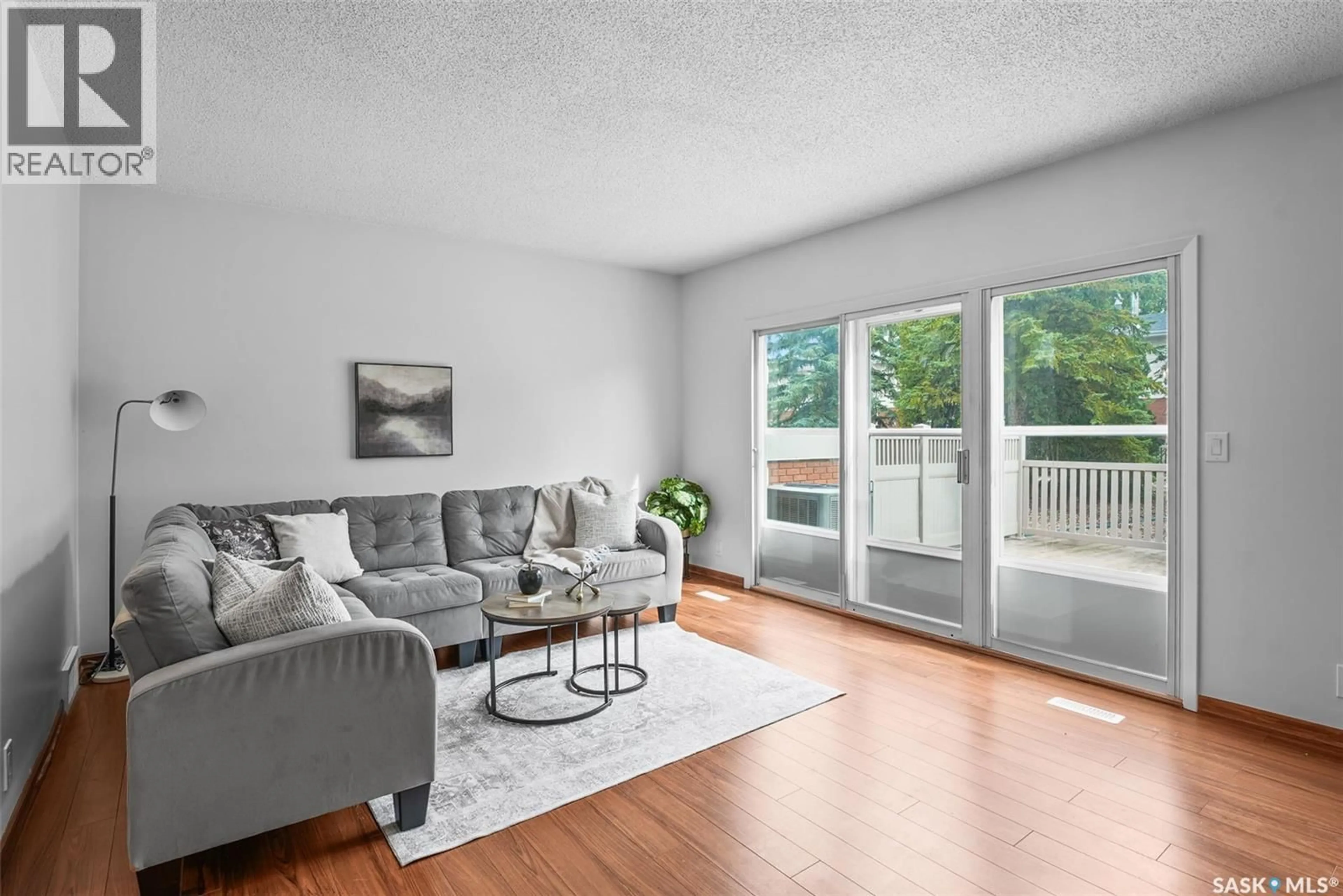 Living room with furniture, wood/laminate floor for 156 PLAINSVIEW DRIVE, Regina Saskatchewan S4S6L2