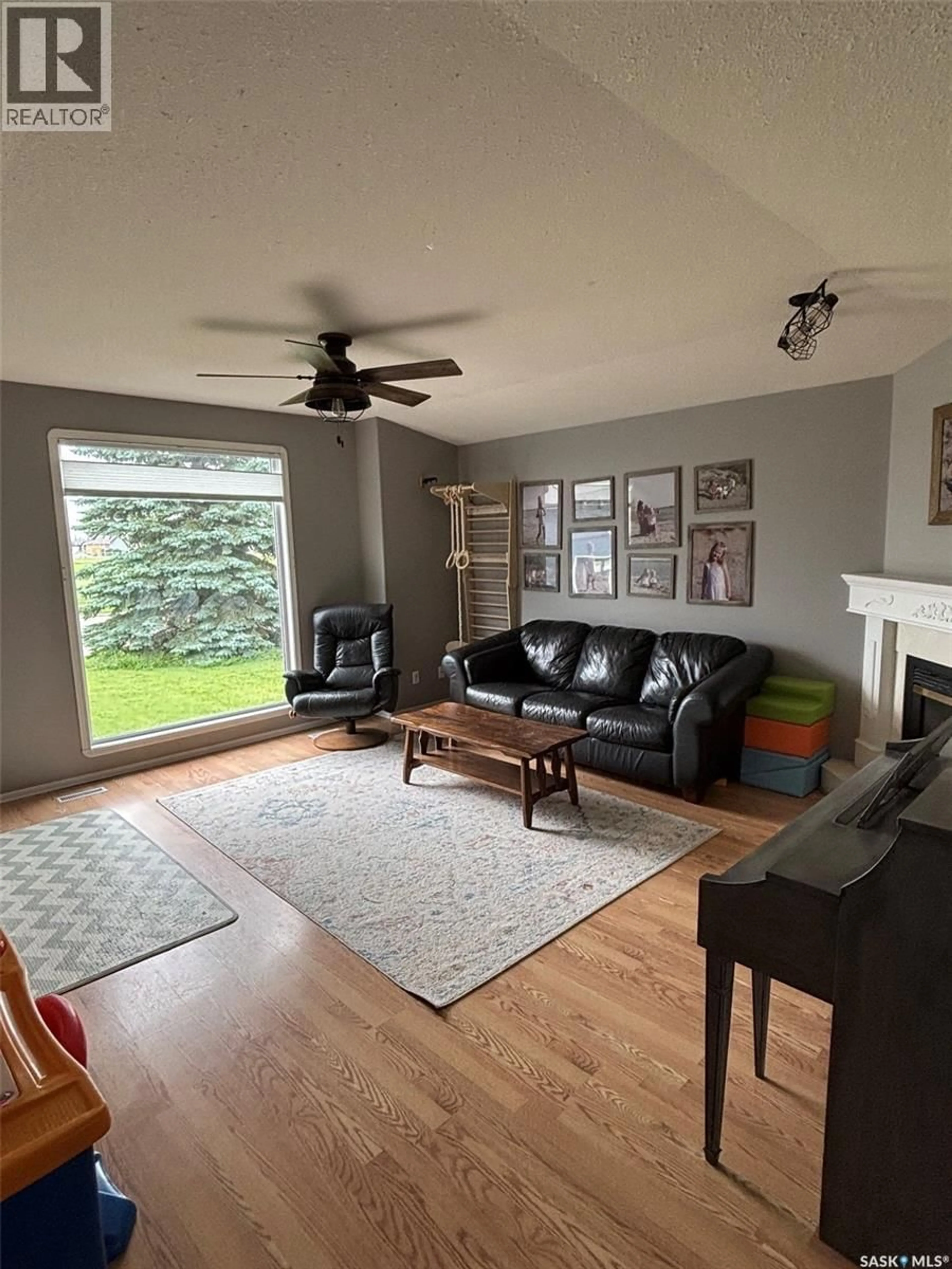 Living room with furniture, wood/laminate floor for 414 DARLINGTON STREET, Yorkton Saskatchewan S3N4A1