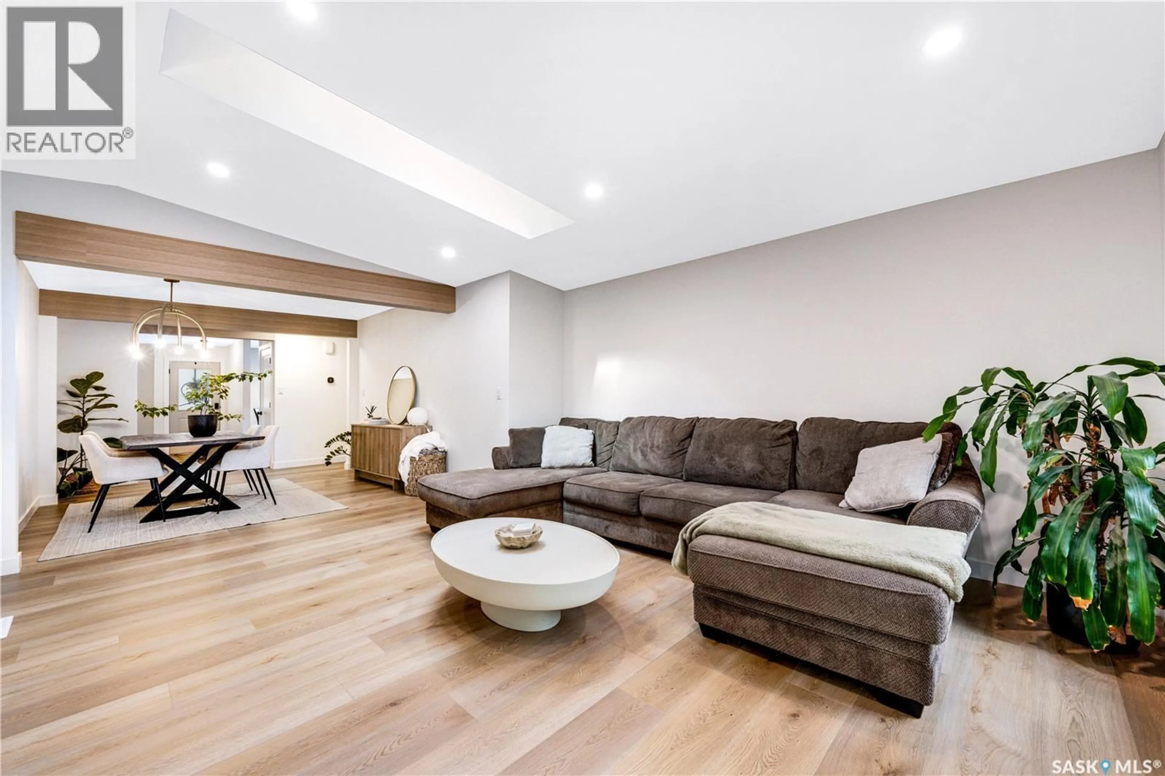 Living room with furniture, wood/laminate floor for 1313 CONN AVENUE, Saskatoon Saskatchewan S7H3K9