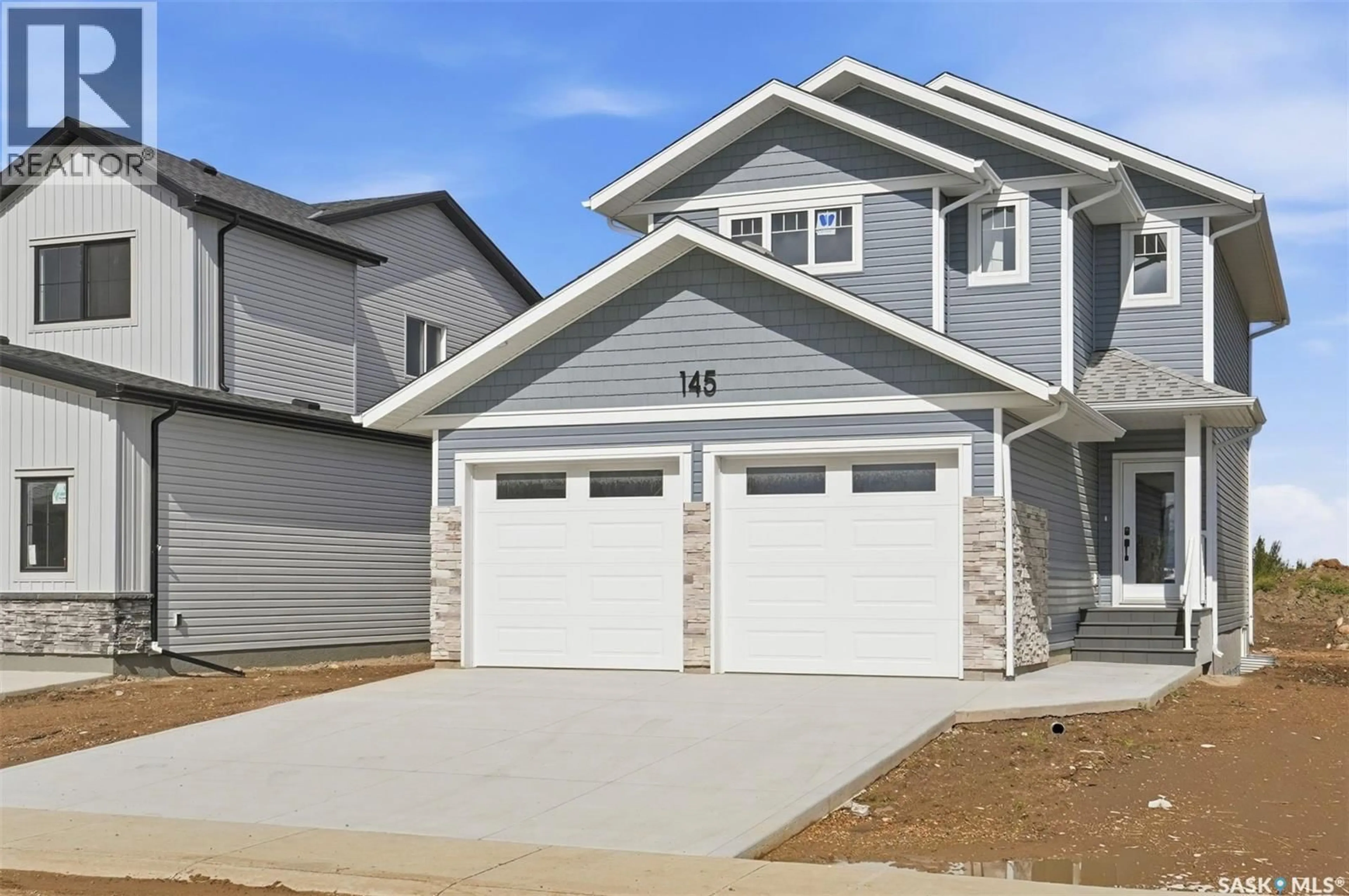 Home with vinyl exterior material, street for 145 EMMA CRESCENT, Martensville Saskatchewan S0K2T0