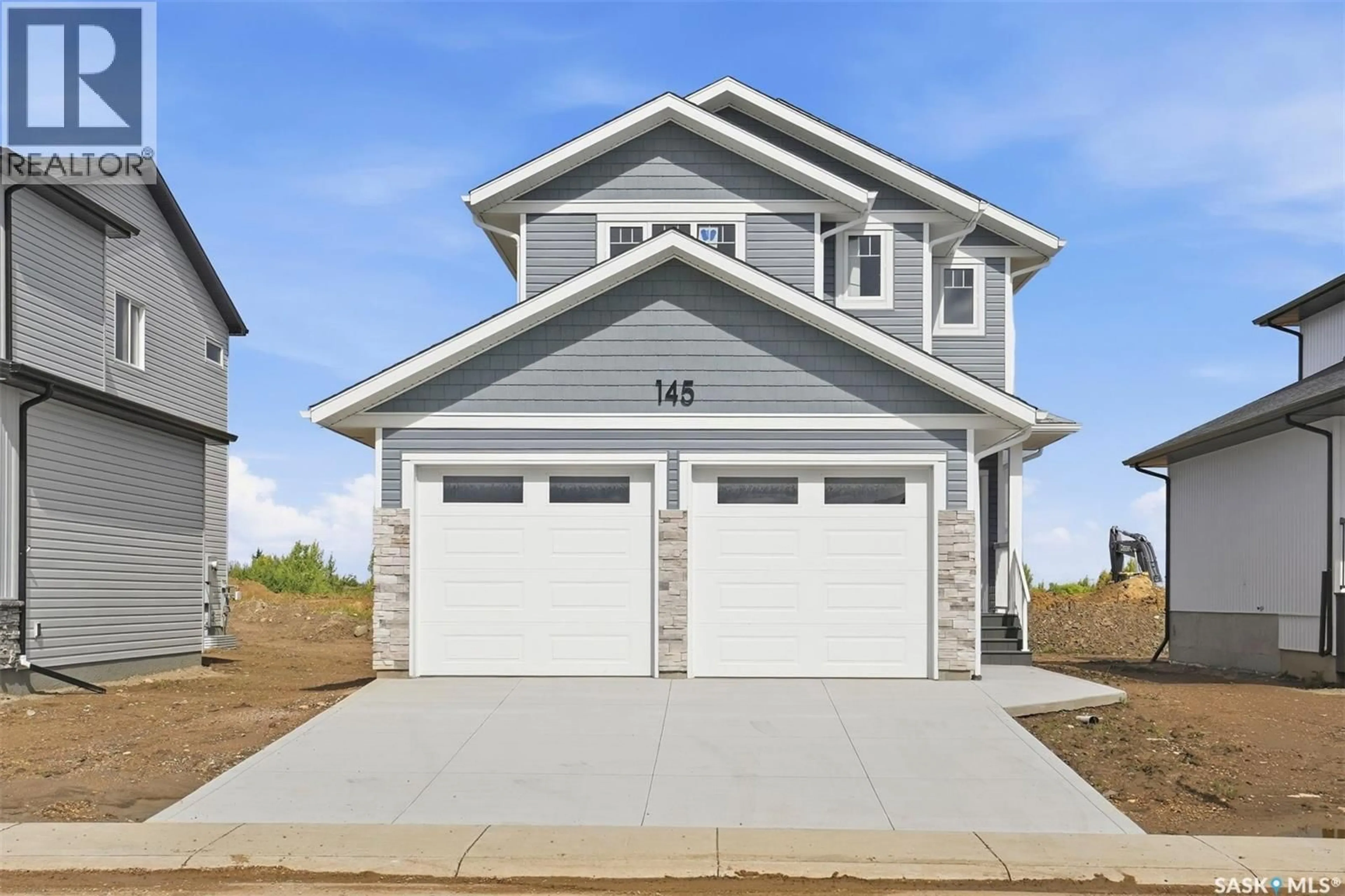 Home with vinyl exterior material, street for 145 EMMA CRESCENT, Martensville Saskatchewan S0K2T0