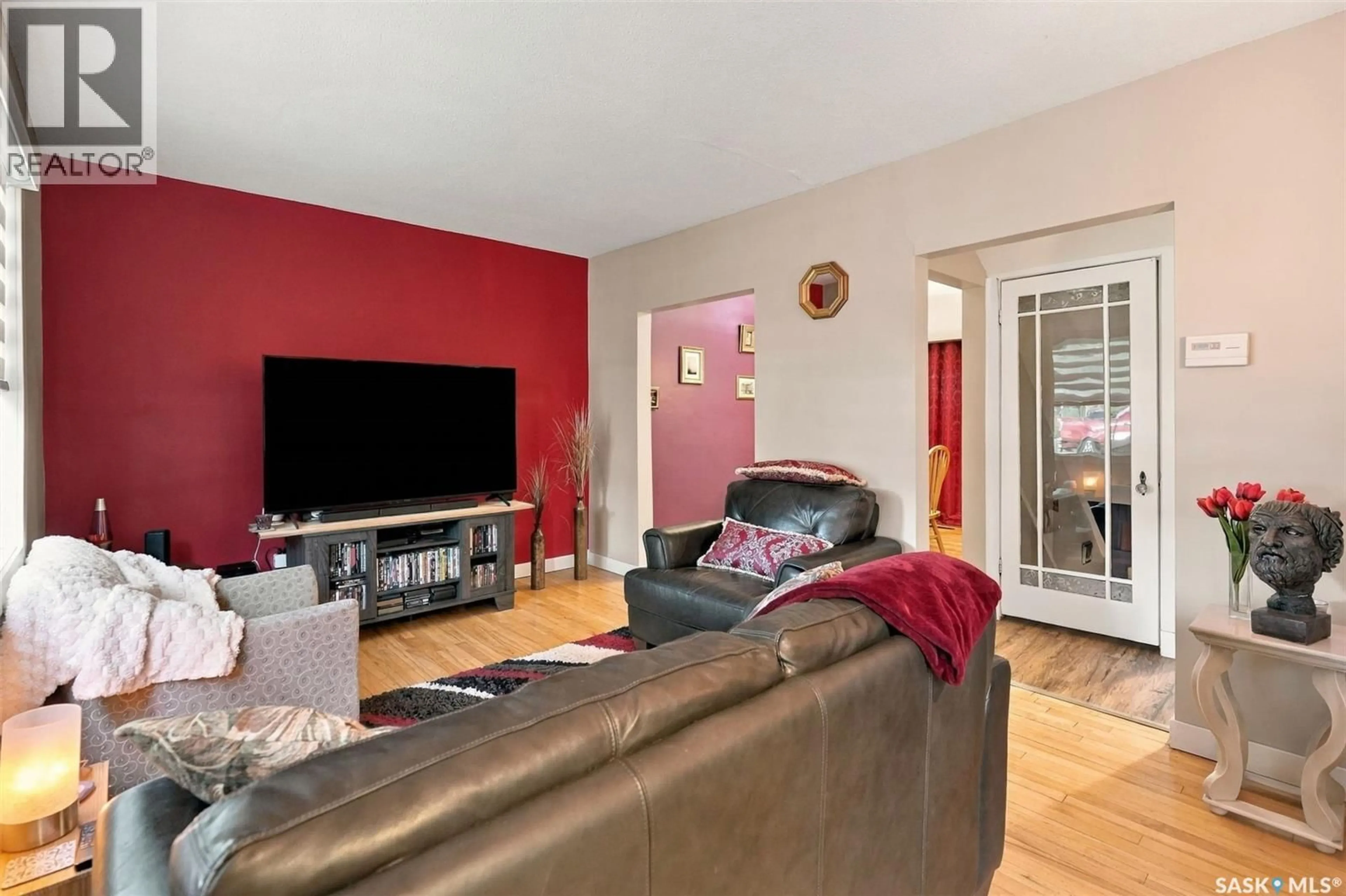 Living room with furniture, wood/laminate floor for 2602 LINDSAY STREET, Regina Saskatchewan S4N3E1