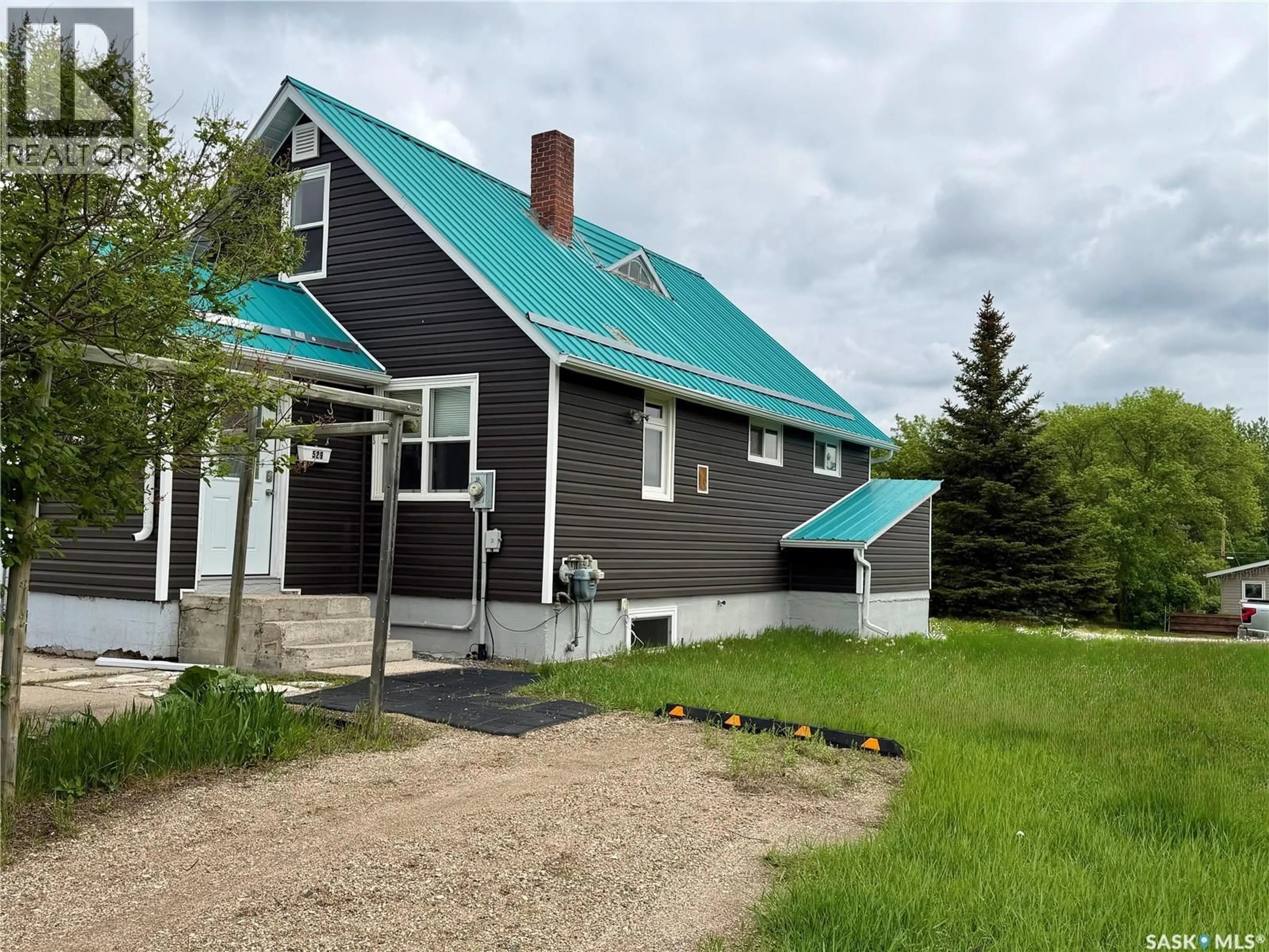 A pic from outside/outdoor area/front of a property/back of a property/a pic from drone, unknown for 529 ALBERT STREET, Hudson Bay Saskatchewan S0E0Y0