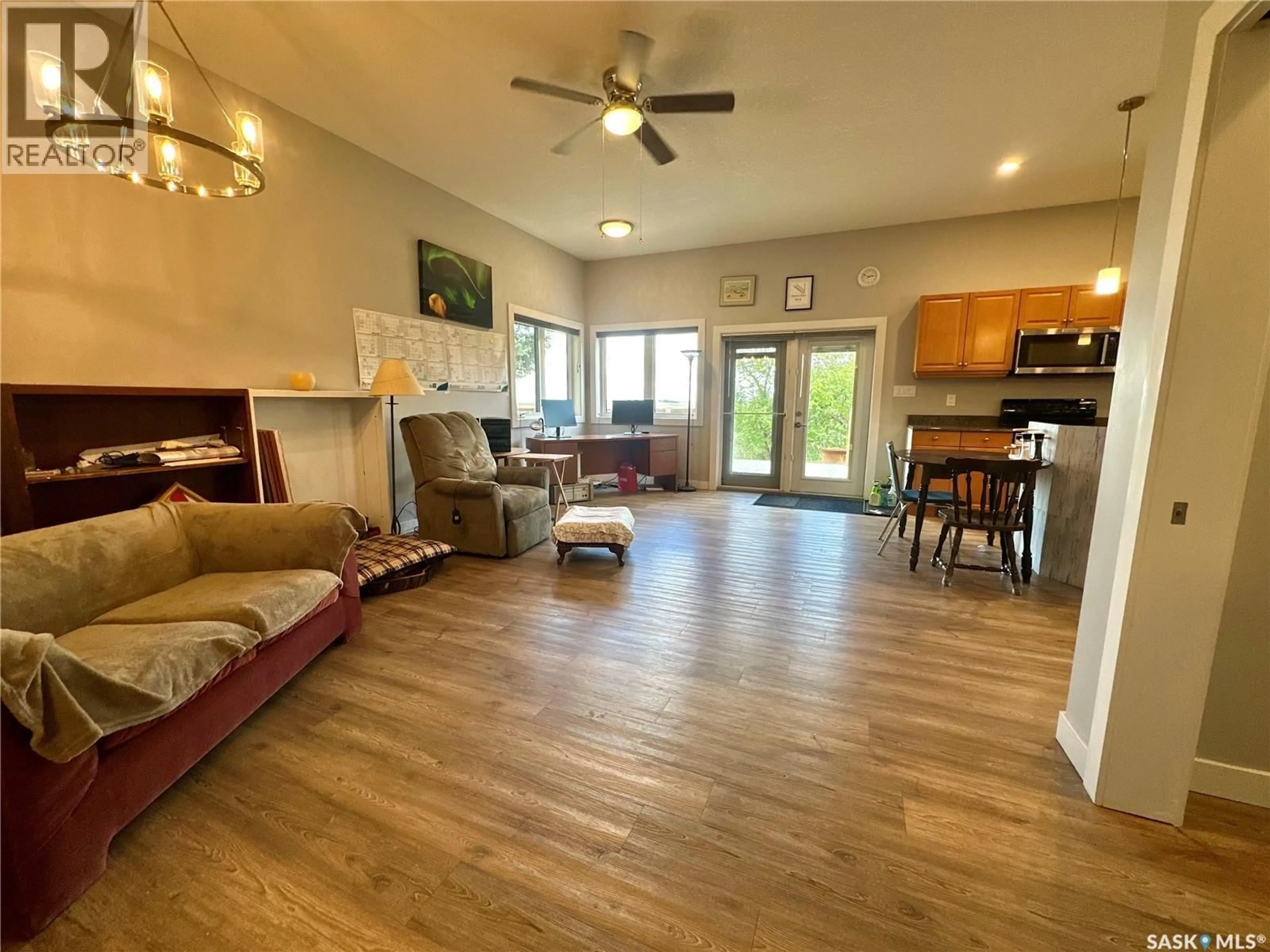 Living room with furniture, wood/laminate floor for 709 2ND STREET, Chamberlain Saskatchewan S0G0R0