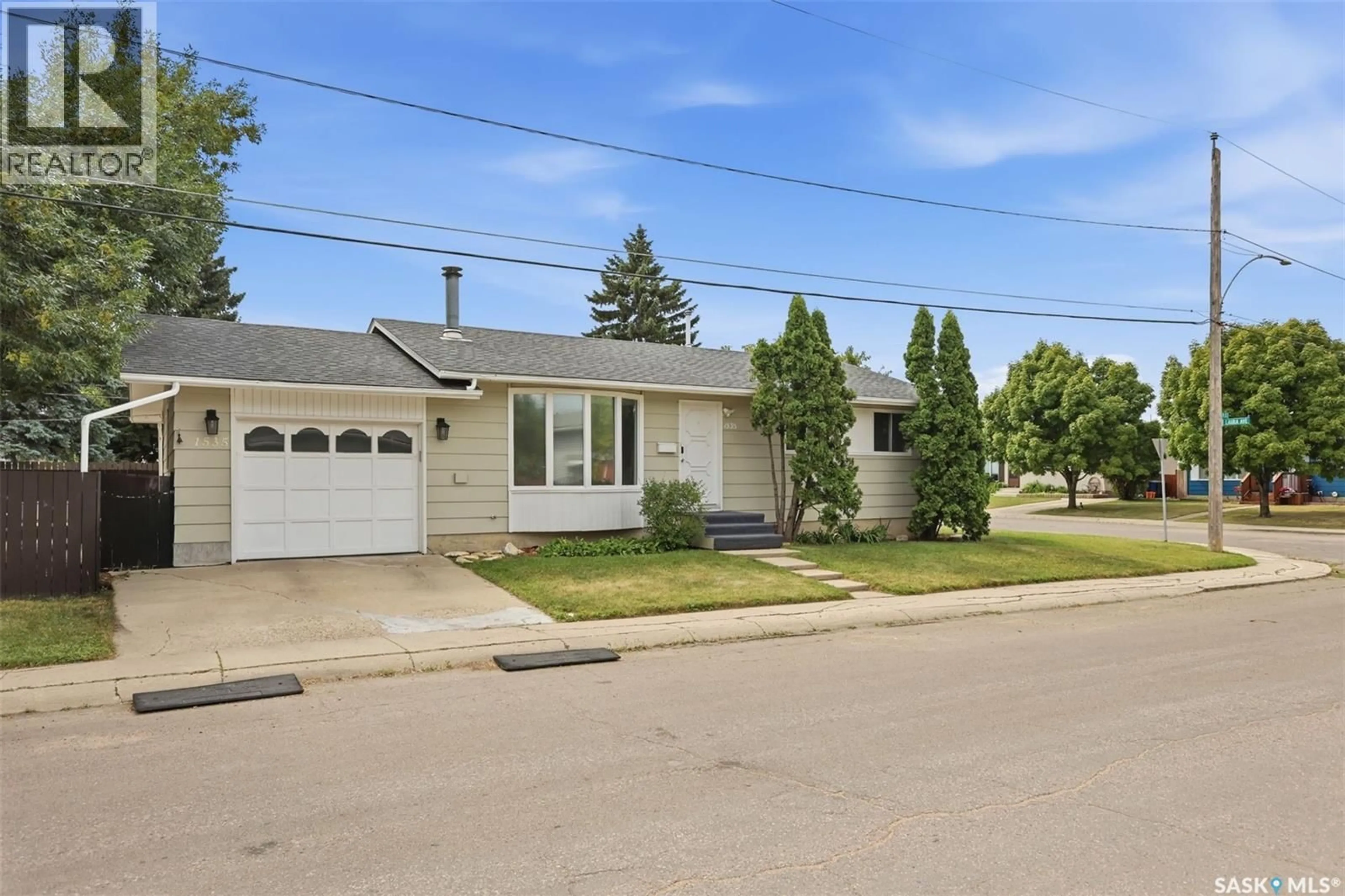 Home with vinyl exterior material, street for 1535 LAURA AVENUE, Saskatoon Saskatchewan S7N2R8
