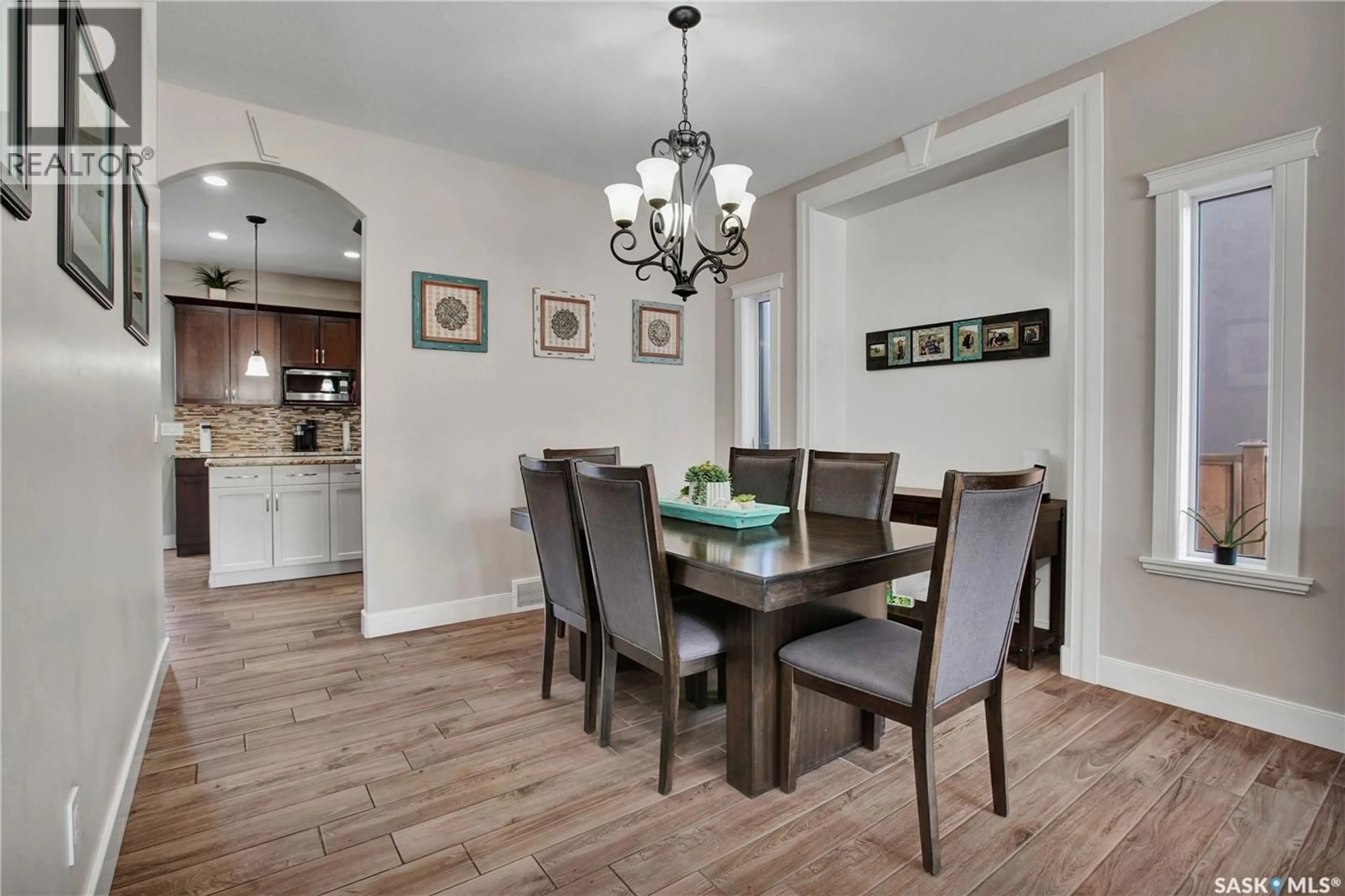Dining room, wood/laminate floor for 714 REDWOOD CRESCENT, Warman Saskatchewan S0K4S2