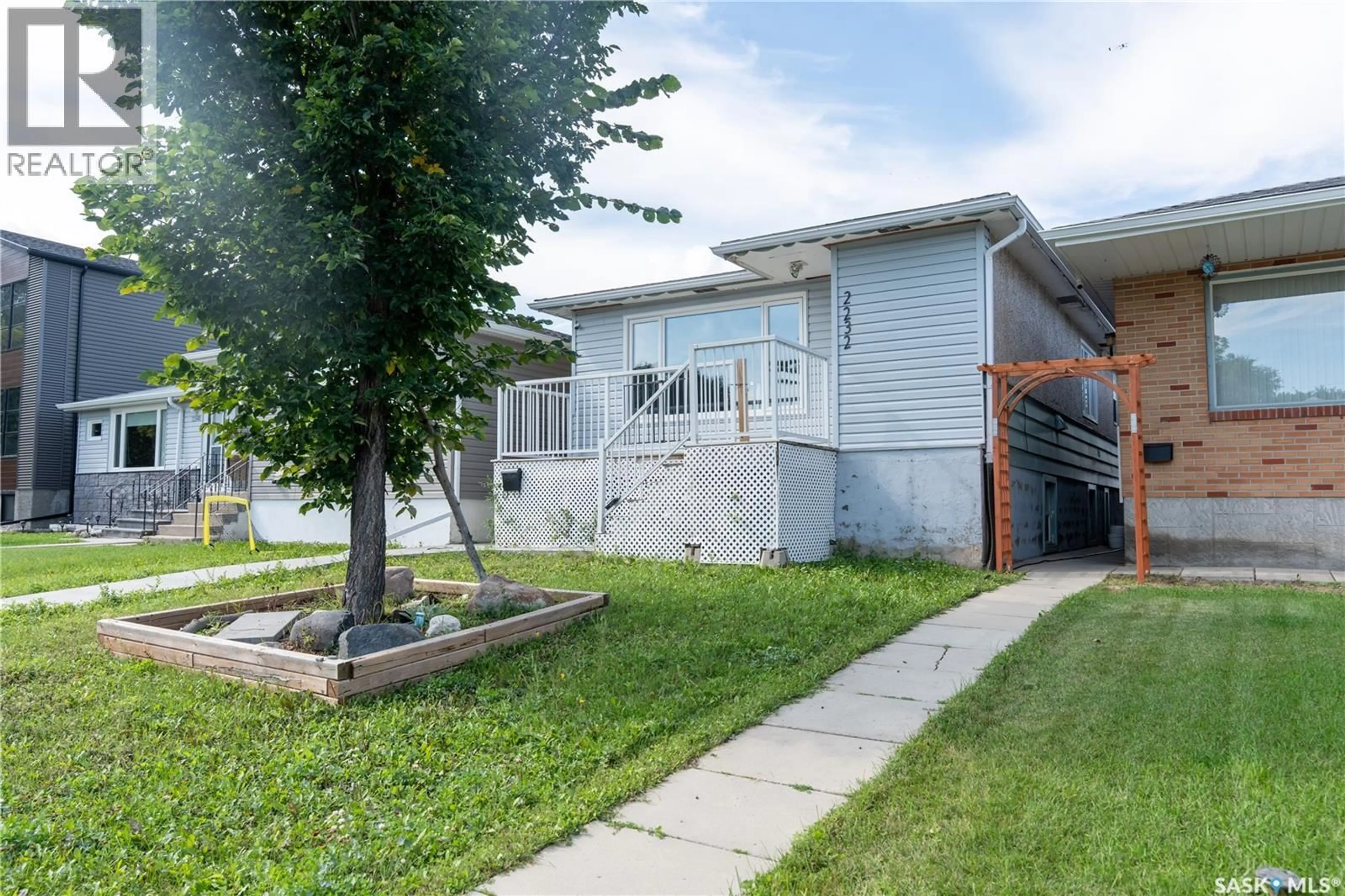Home with vinyl exterior material, street for 2232 MCARA STREET, Regina Saskatchewan S4N2W1