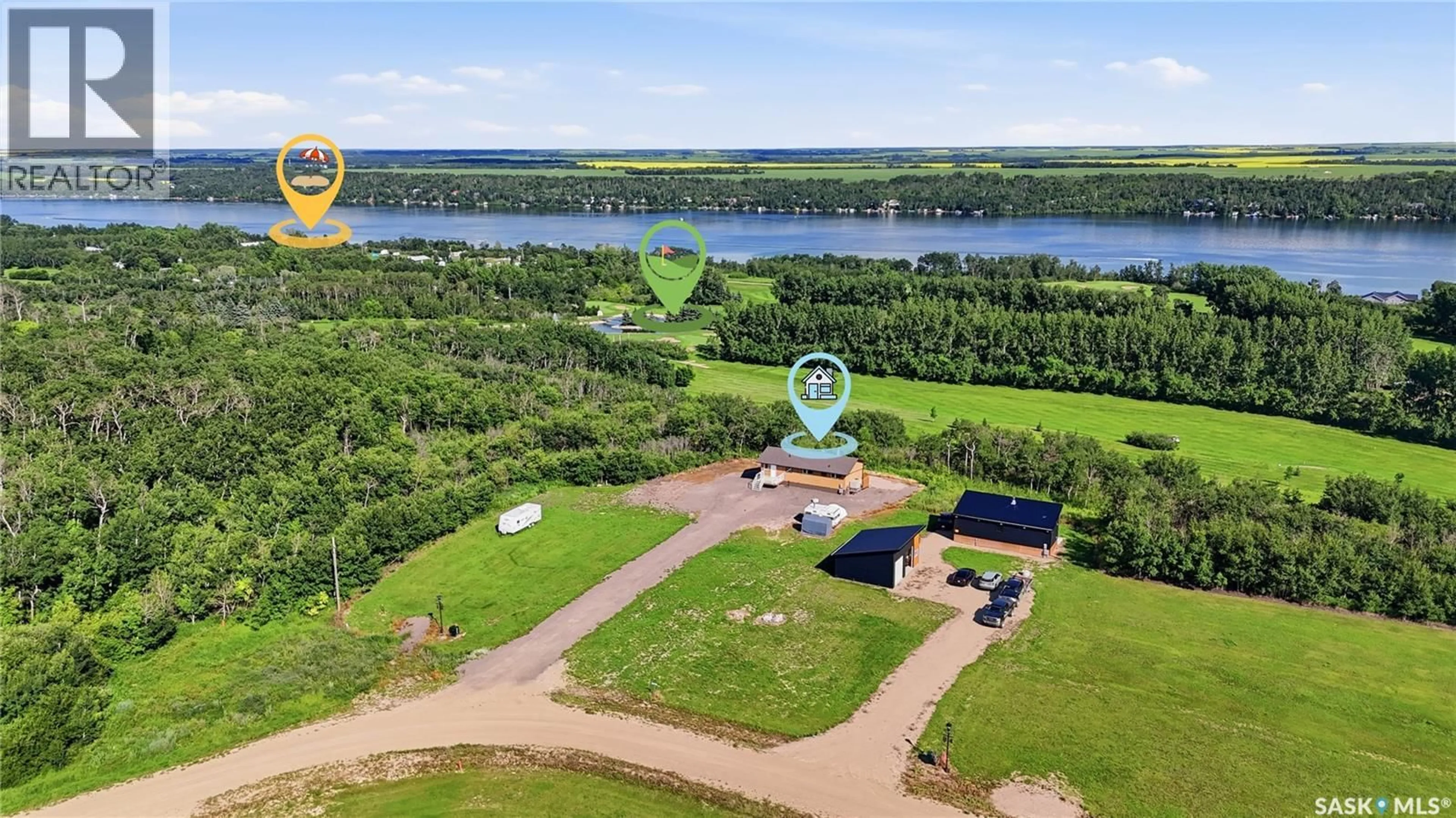 A pic from outside/outdoor area/front of a property/back of a property/a pic from drone, water/lake/river/ocean view for 7000 WACASA RIDGE, Wakaw Lake Saskatchewan S0K4P0