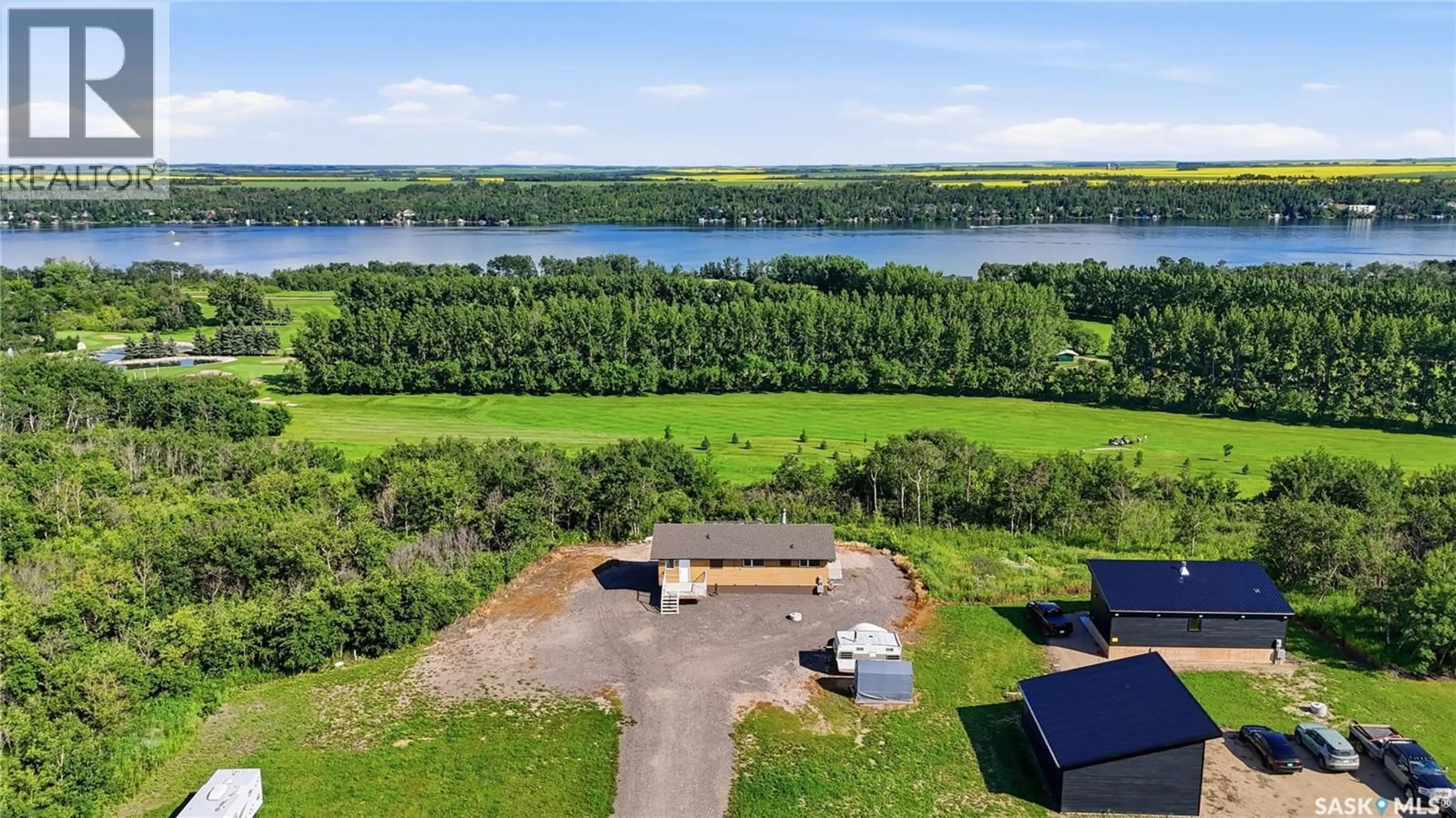 A pic from outside/outdoor area/front of a property/back of a property/a pic from drone, water/lake/river/ocean view for 7000 WACASA RIDGE, Wakaw Lake Saskatchewan S0K4P0