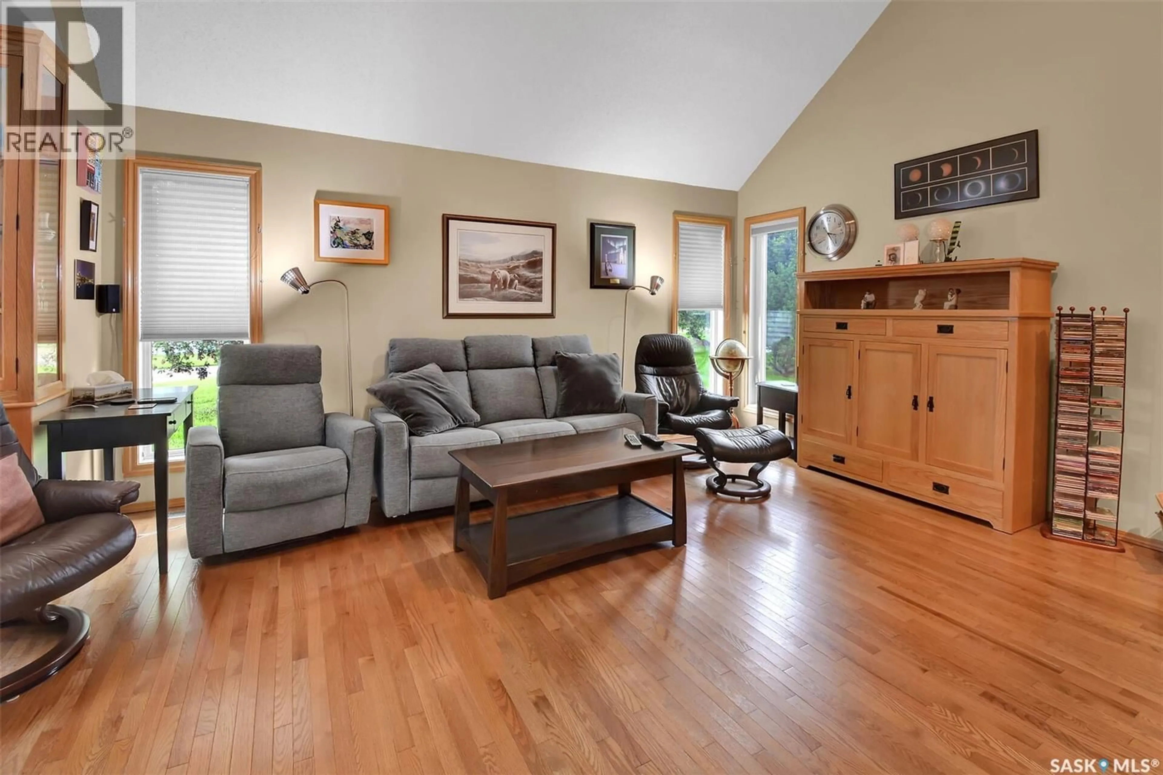 Living room with furniture, wood/laminate floor for RYSTROM ACREAGE, Corman Park Rm No. 344 Saskatchewan S7K3J8