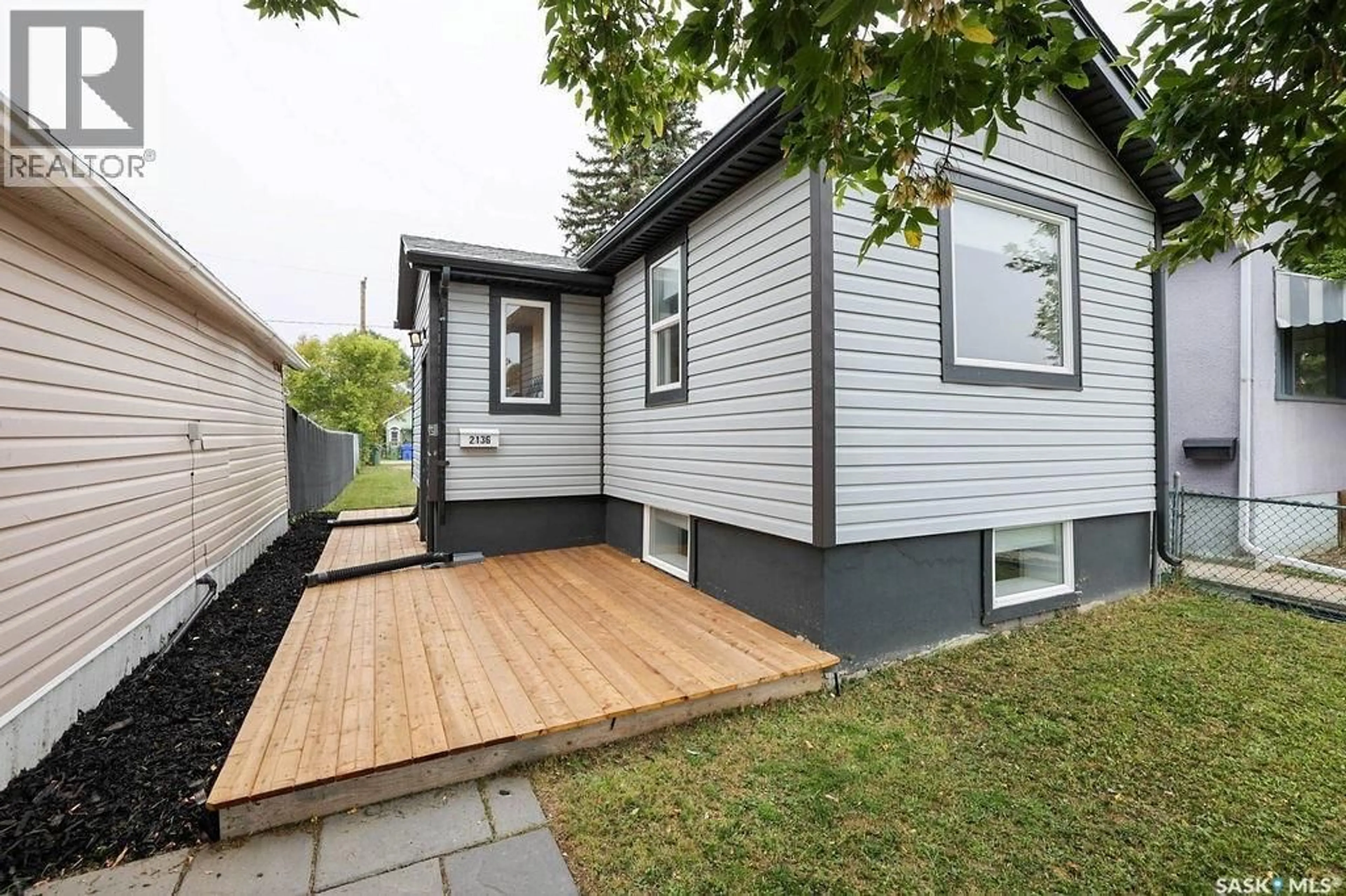 Home with vinyl exterior material, street for 2136 MCARA STREET, Regina Saskatchewan S4N2V8