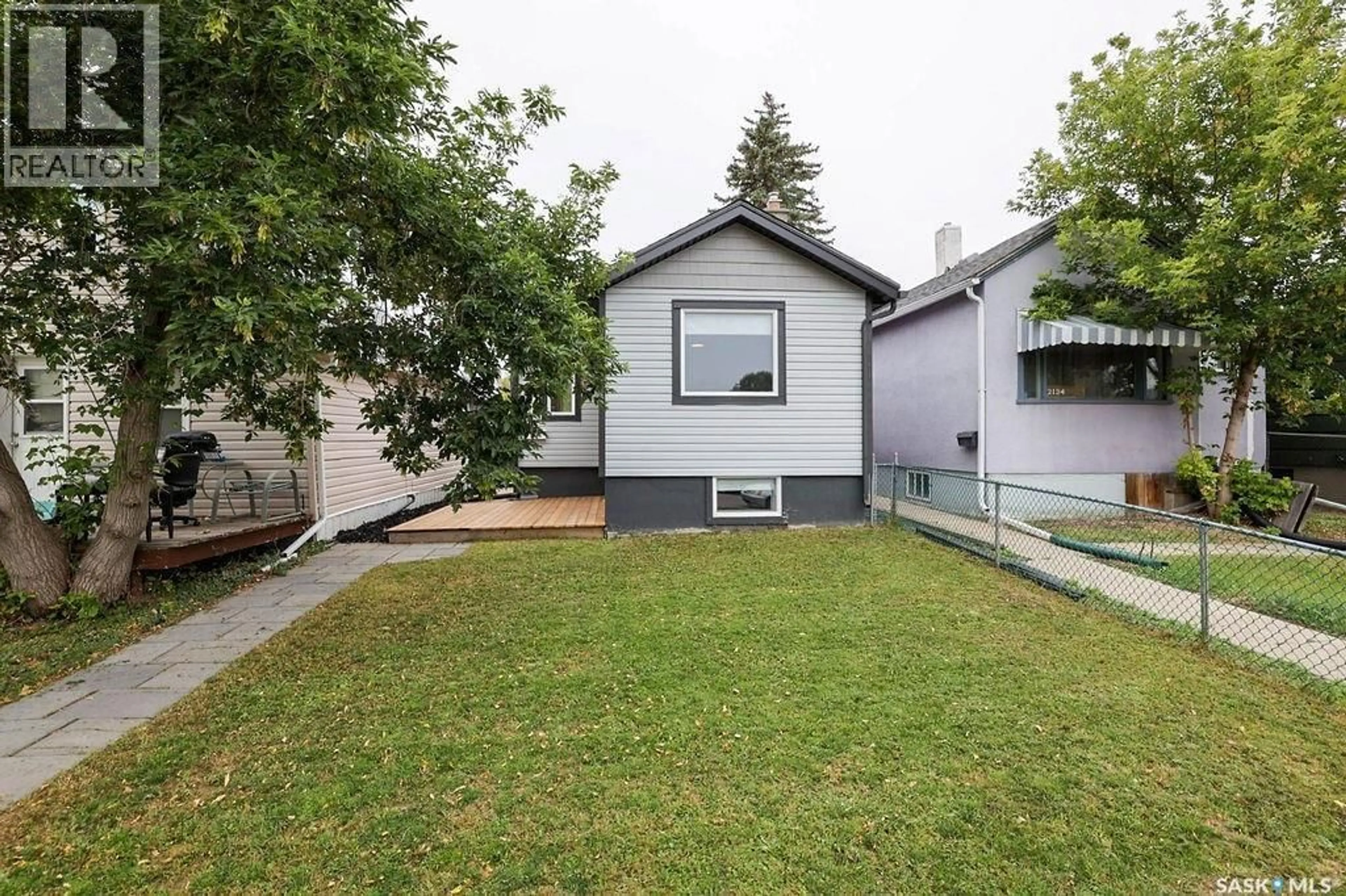 Home with vinyl exterior material, street for 2136 MCARA STREET, Regina Saskatchewan S4N2V8