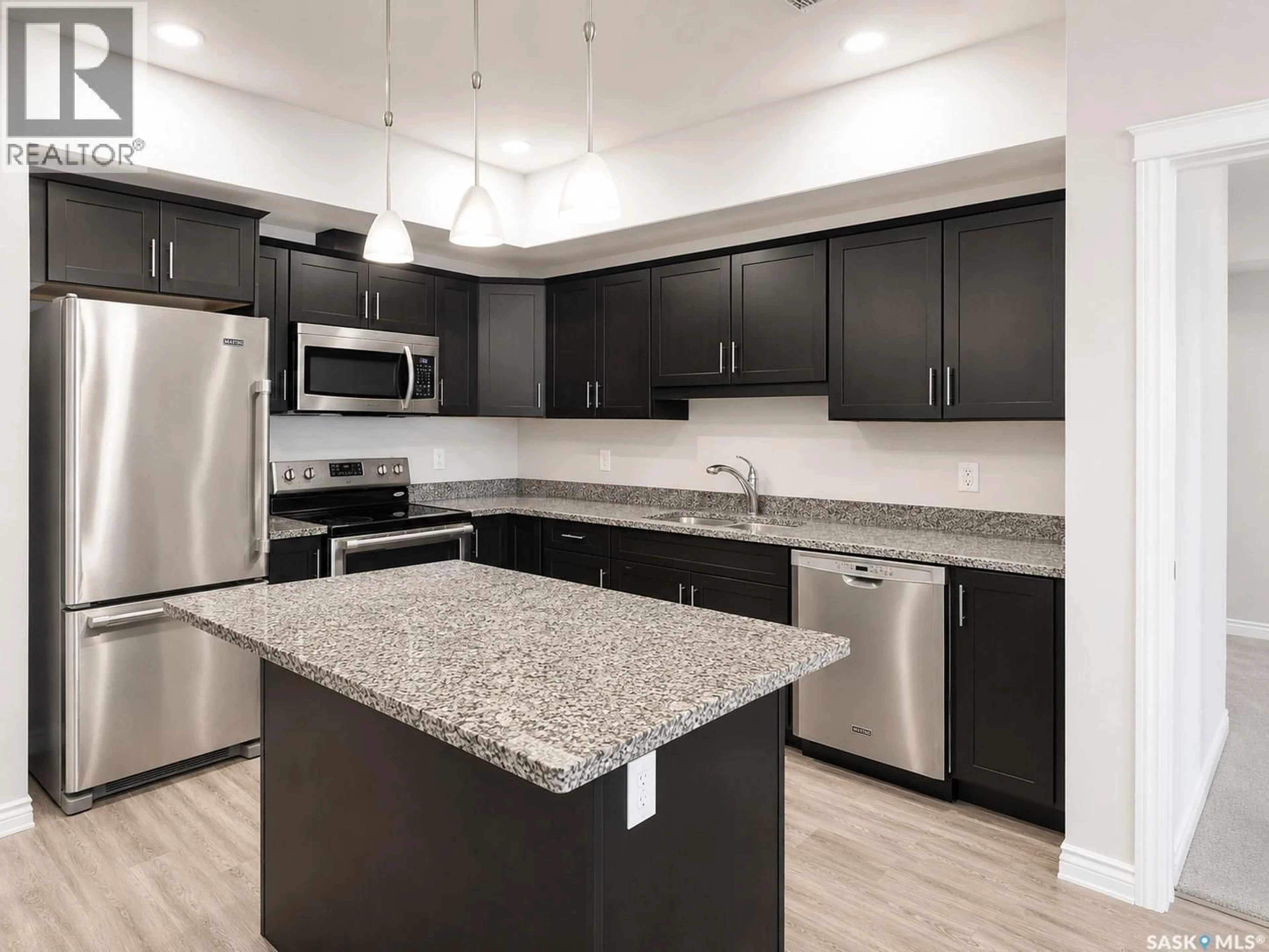 Open concept kitchen, ceramic/tile floor for 412 - 309 WILLOWGROVE SQUARE, Saskatoon Saskatchewan S7W0E5