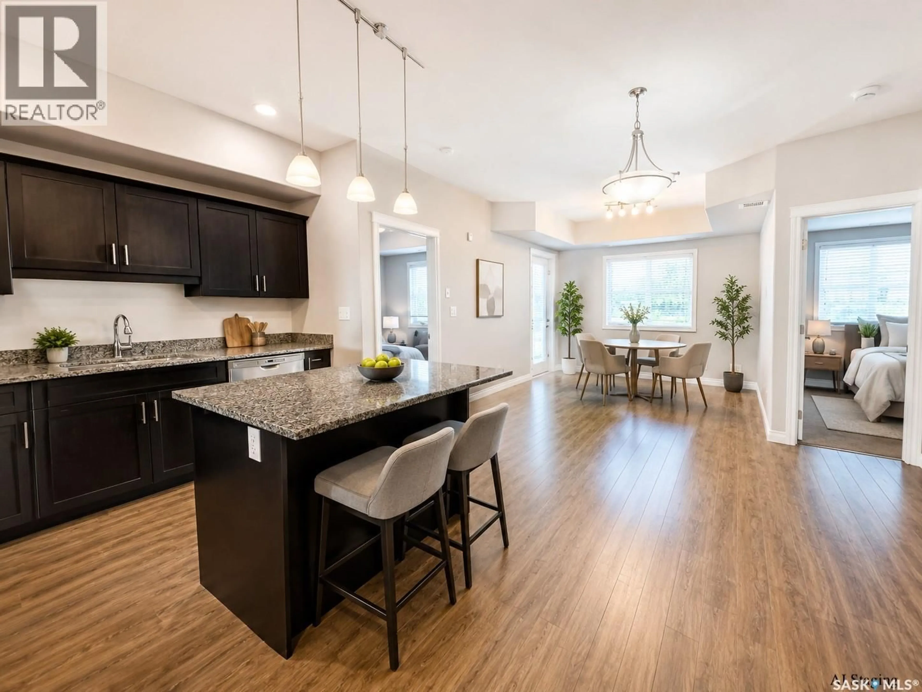 Open concept kitchen, wood/laminate floor for 412 - 309 WILLOWGROVE SQUARE, Saskatoon Saskatchewan S7W0E5