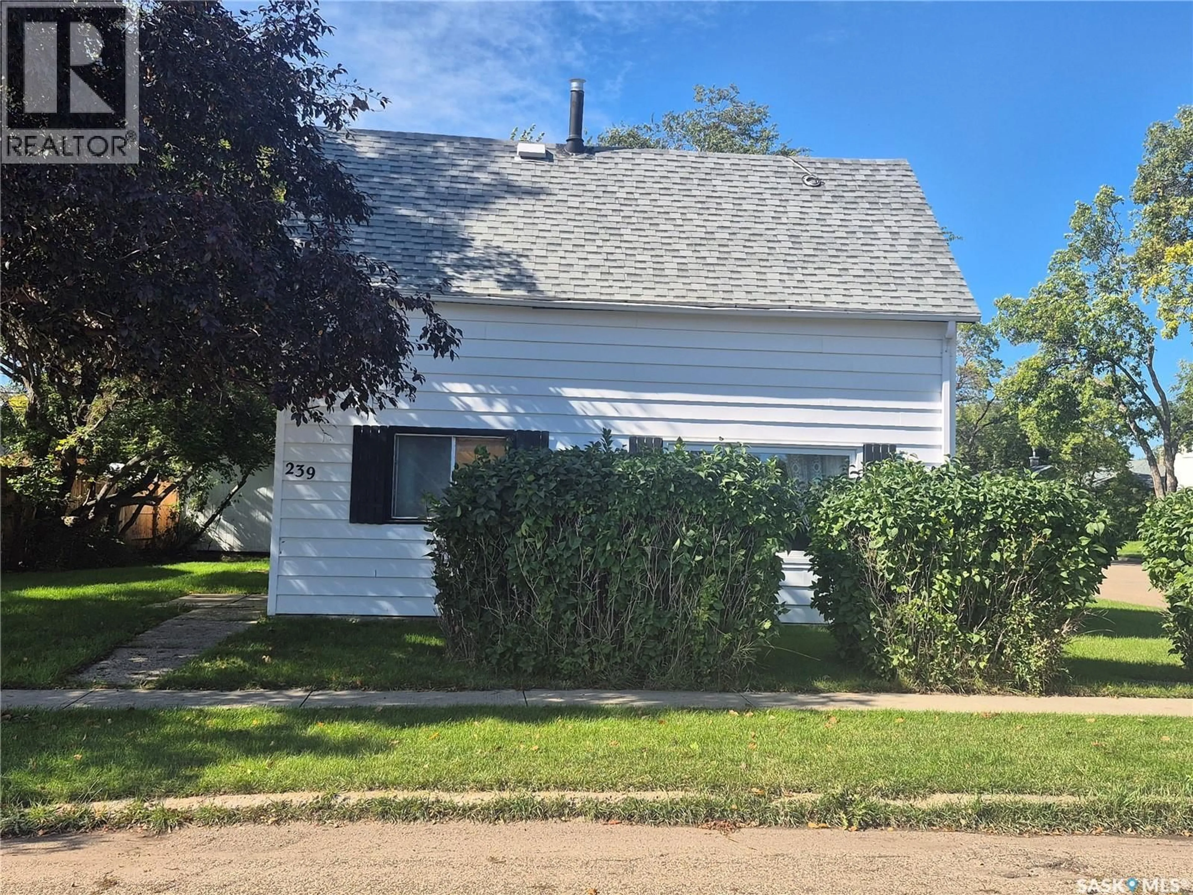 Home with vinyl exterior material, street for 239 9TH STREET, Weyburn Saskatchewan S4H1E9