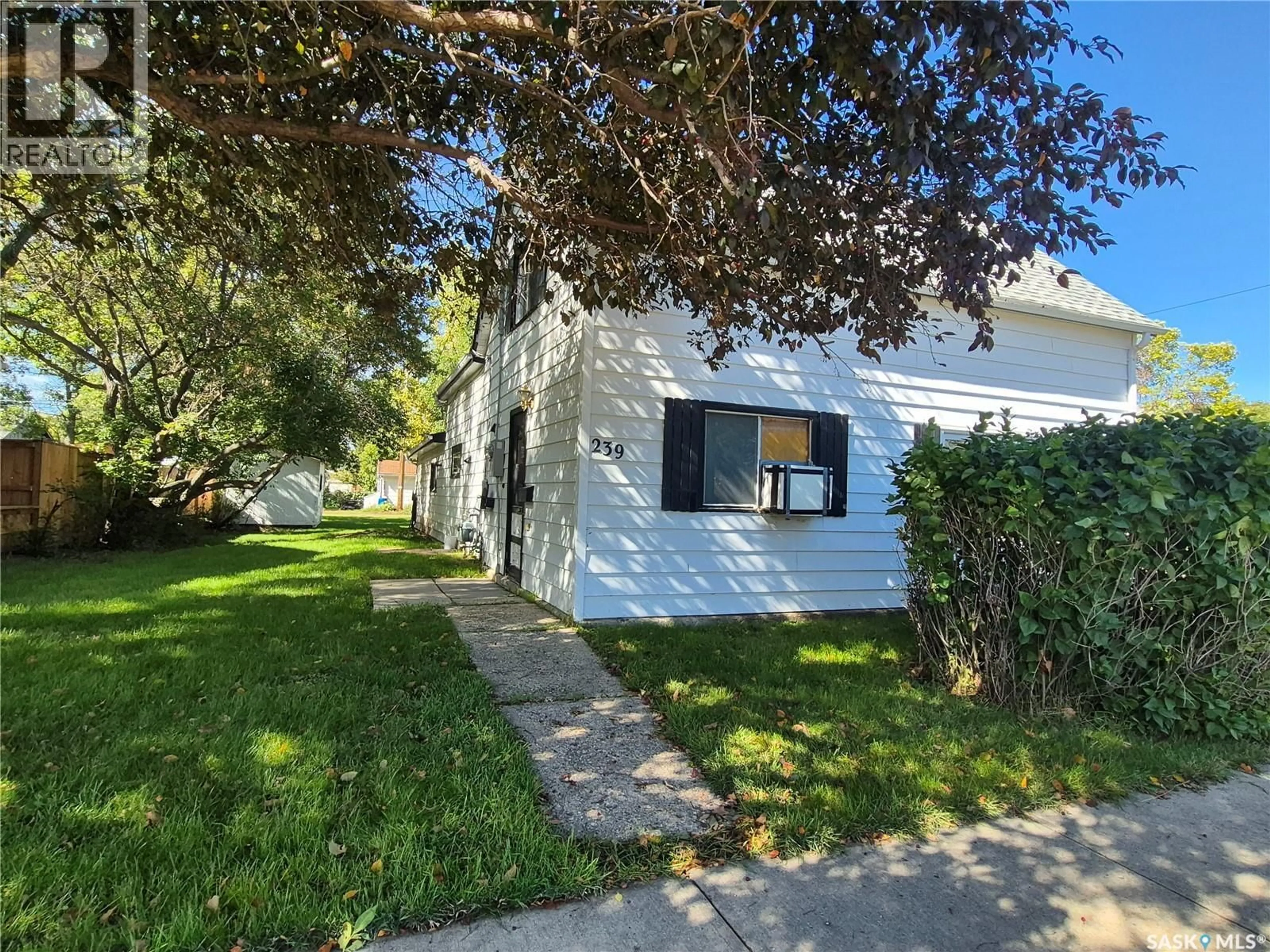 A pic from outside/outdoor area/front of a property/back of a property/a pic from drone, street for 239 9TH STREET, Weyburn Saskatchewan S4H1E9