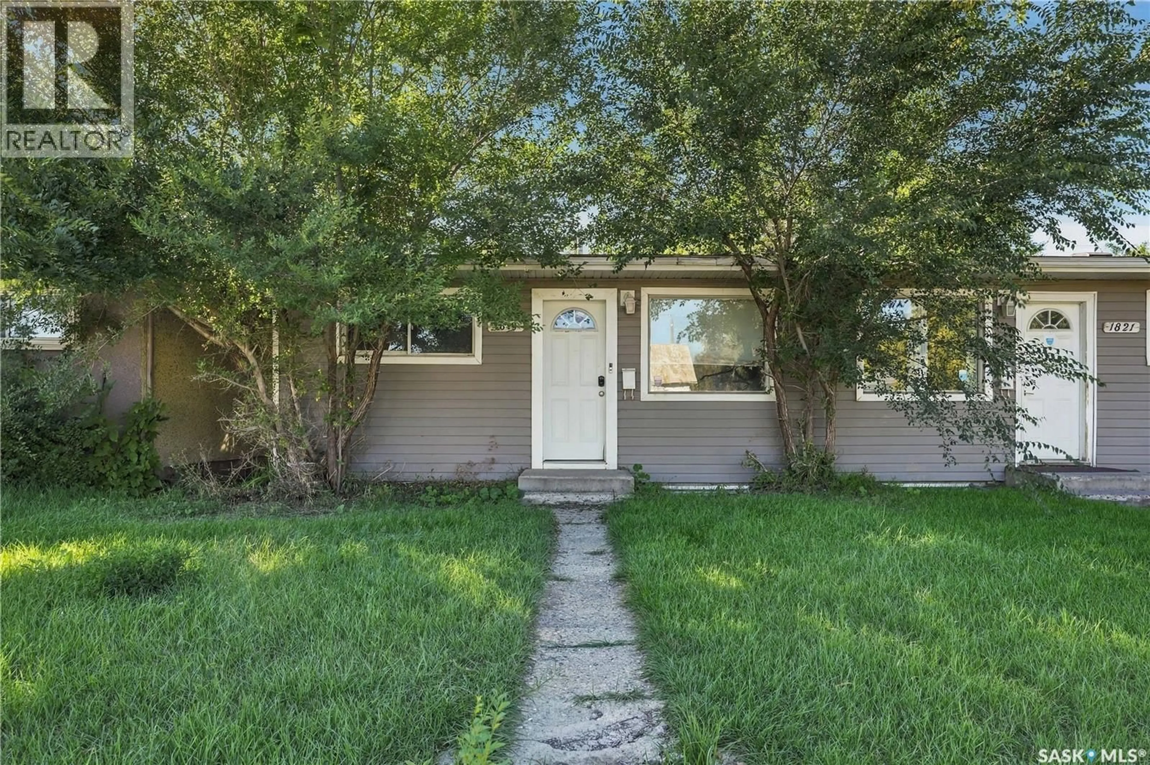 Home with vinyl exterior material, street for 1819 C AVENUE, Saskatoon Saskatchewan S7L1N9