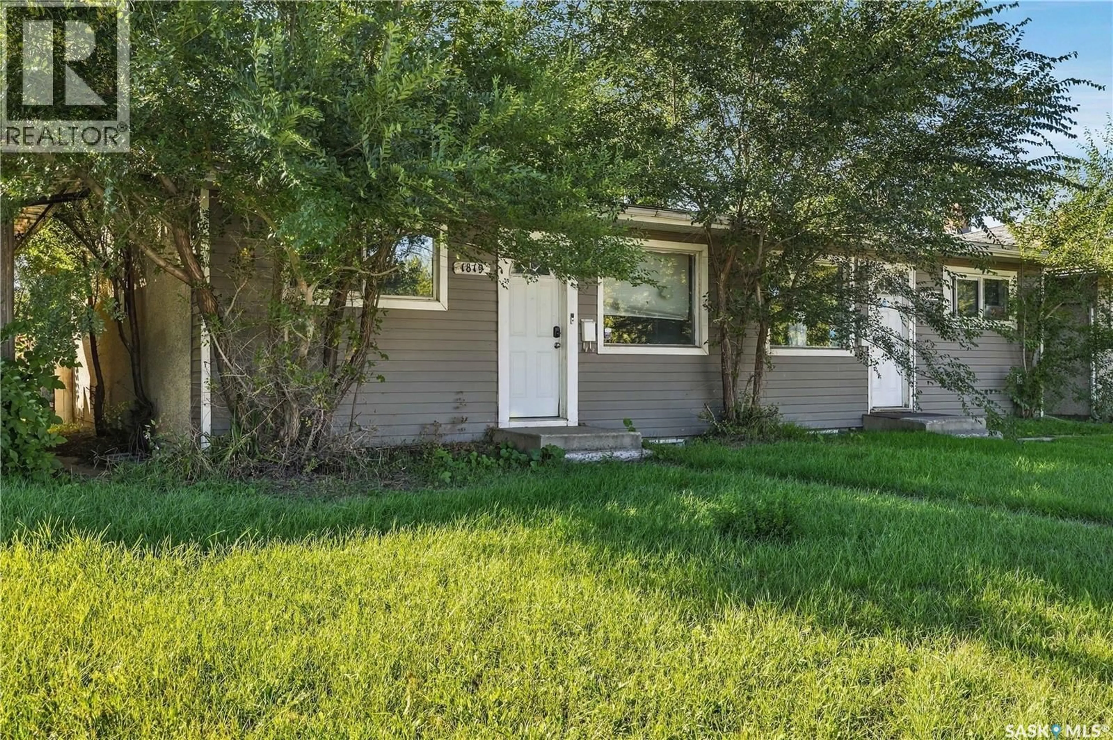 Home with vinyl exterior material, street for 1819 C AVENUE, Saskatoon Saskatchewan S7L1N9